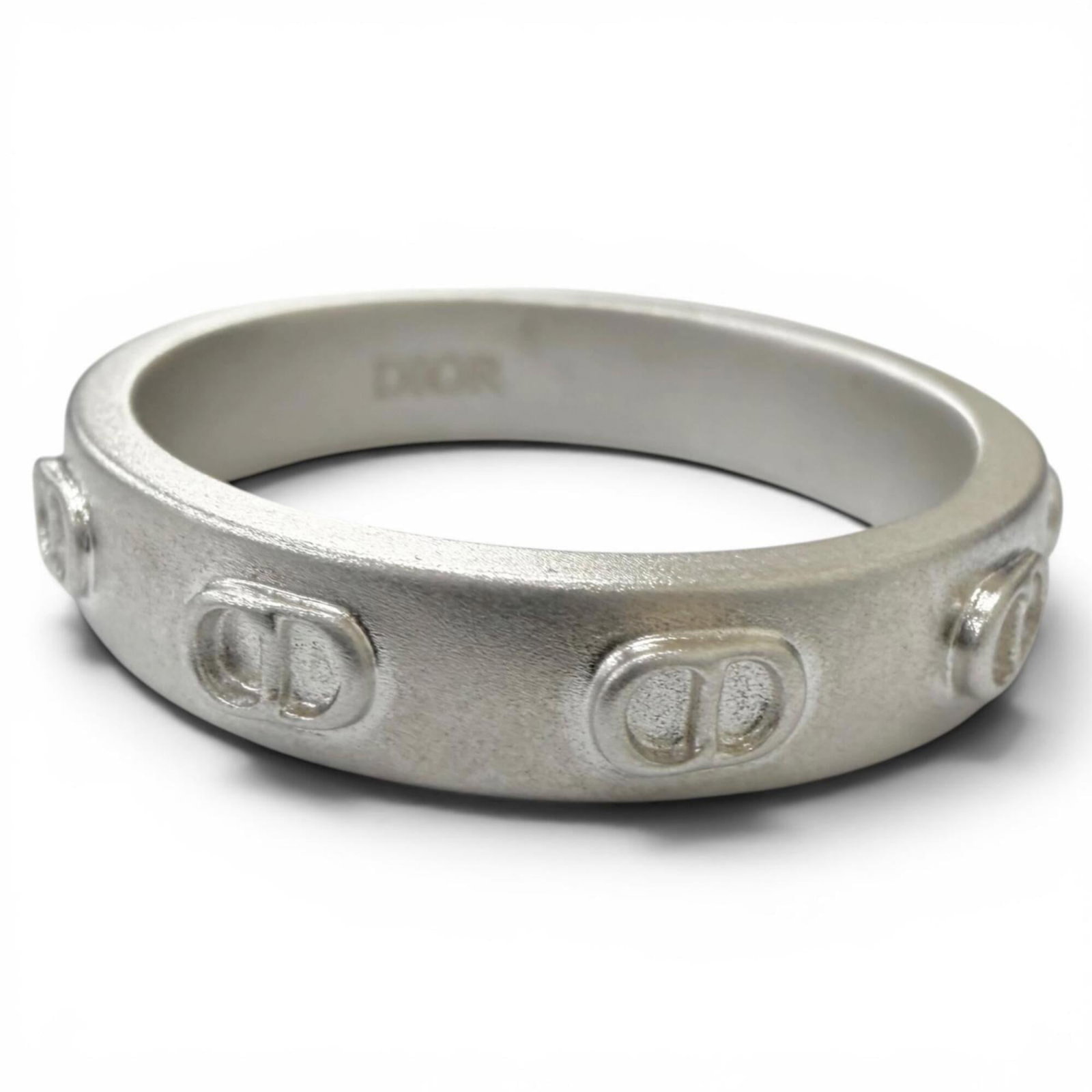 Silver Band Ring 925 Dior Homme: Silver Band Ring 925 Dior Homme Silver Band Ring 925 Dior Homme features a sleek silver band with a classic design, perfect for everyday wear. Made from high-quality silver material (925), this ring