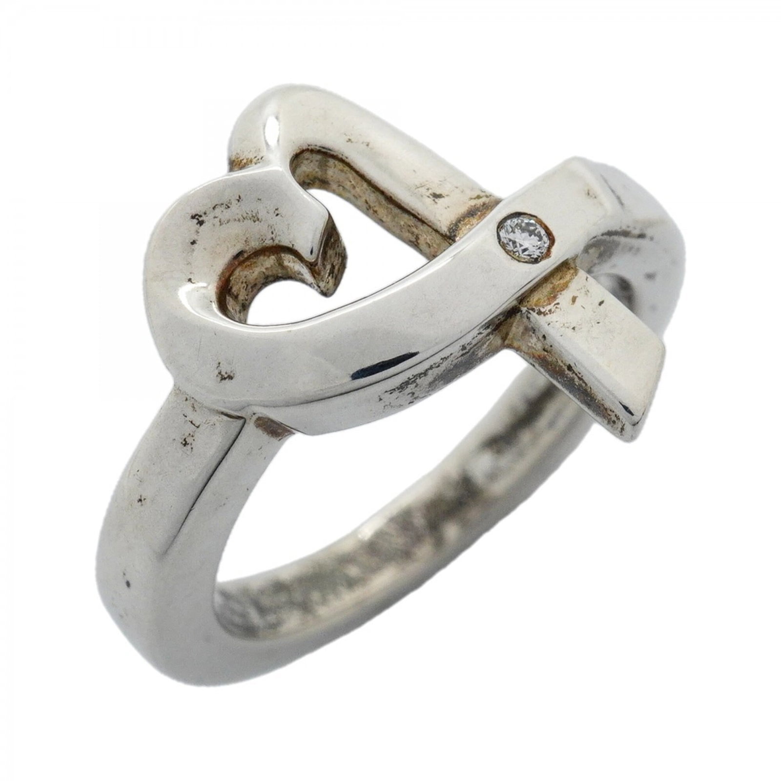 Silver band ring Tiffany 925: Silver band ring Tiffany 925 Silver band ring Tiffany 925 features a diamond stone set in sterling silver. This elegant ring is available in US size 6.5, making it a great fit for those seeking a clas