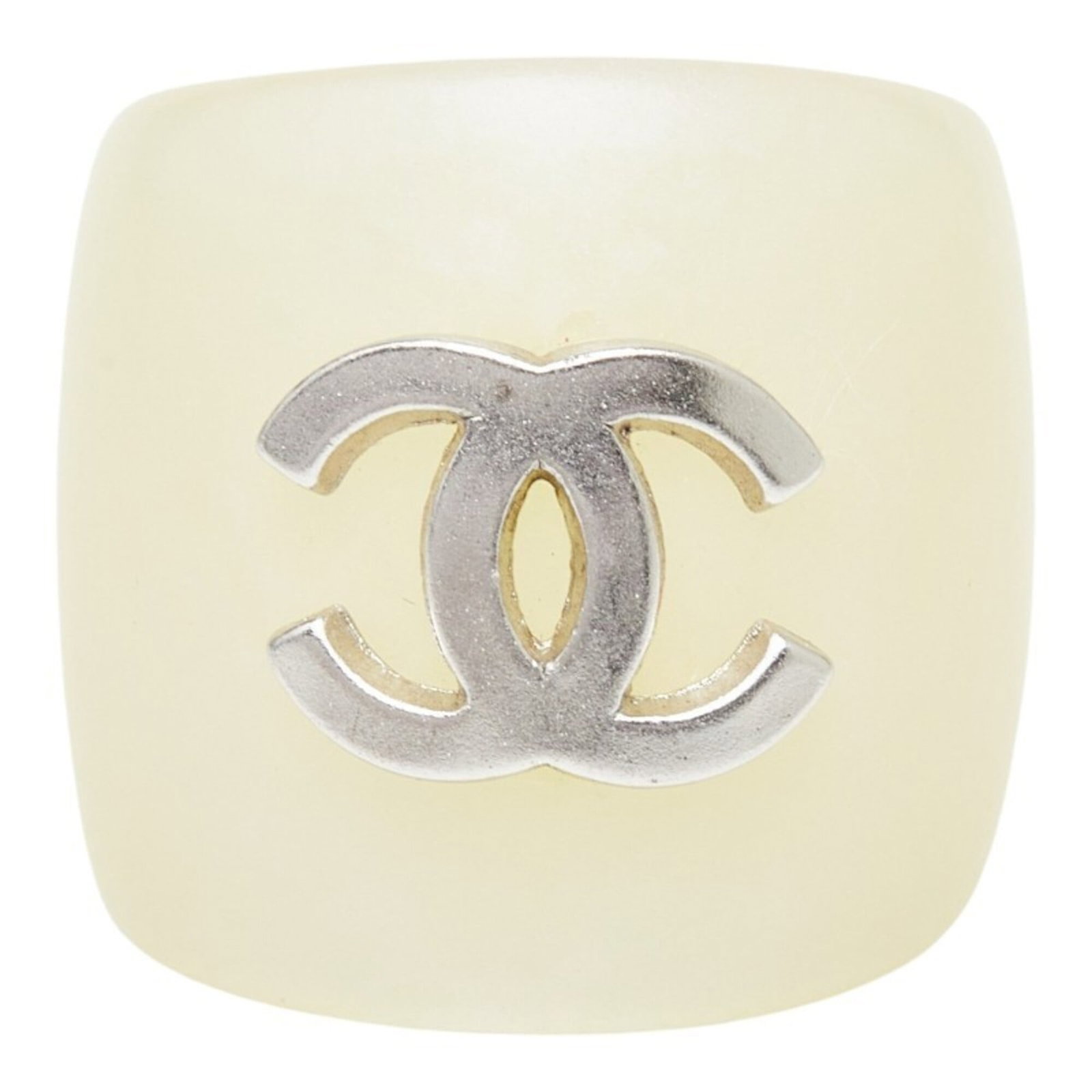 Chanel Band Ring Plastic: Chanel Band Ring Plastic The Chanel Band Ring Plastic boasts an elegant ivory hue, adding a touch of sophistication to any outfit. Made from high-quality plastic, this band ring features a classic des