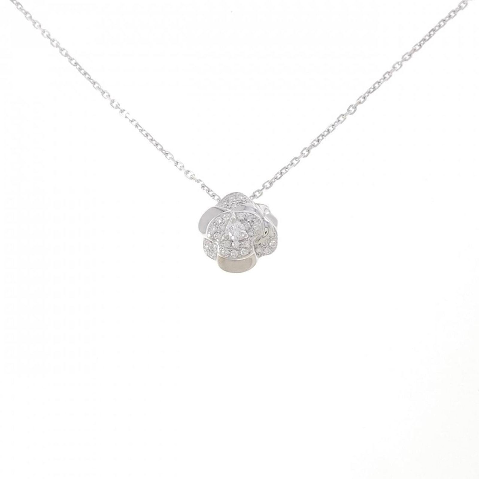 Camellia Necklace by Chanel: Camellia Necklace by Chanel White gold (18K) pendant featuring a diamond, set on a chain with a 38 cm / 14.96'' circumference, and measuring 12.7mm x 12.4mm in size. This Chanel necklace boasts elegan