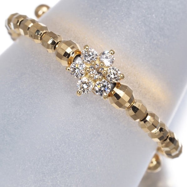 Diamond 0.10Ct Flower One Size Fits All Ring 18K 750 Yellow Gold: Diamond 0.10Ct Flower One Size Fits All Ring 18K 750 Yellow Gold Yellow gold 18k flower ring with a natural diamond accent, featuring a total of 0.10ct of sparkle in a delicate flower design. The
