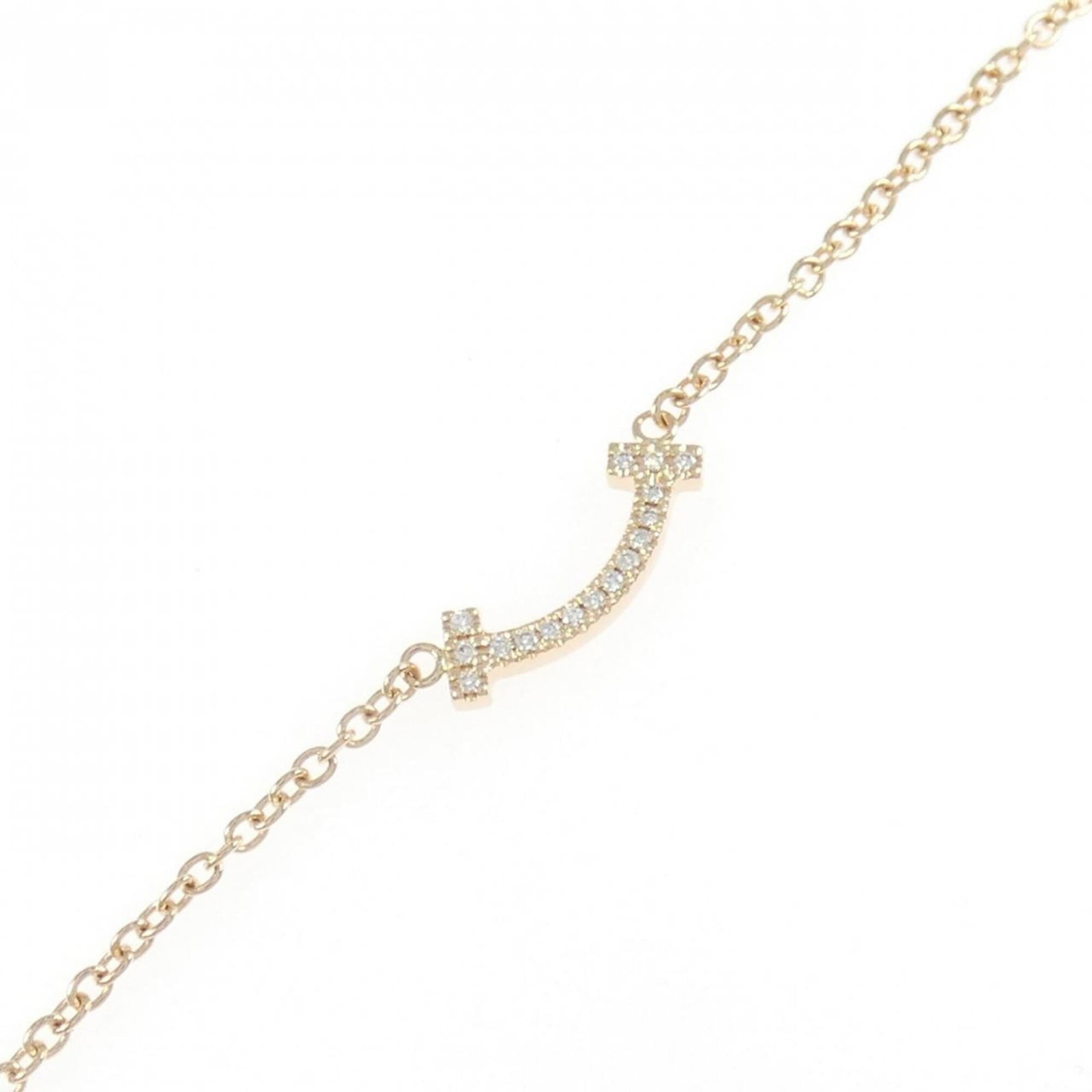 Pink Gold 18K Tiffany Charm Bracelet: Pink Gold 18K Tiffany Charm Bracelet Pink gold (18K) charm bracelet with a diamond stone, measuring 15.5cm in length. This Tiffany-designed piece showcases the brand's signature style and attention