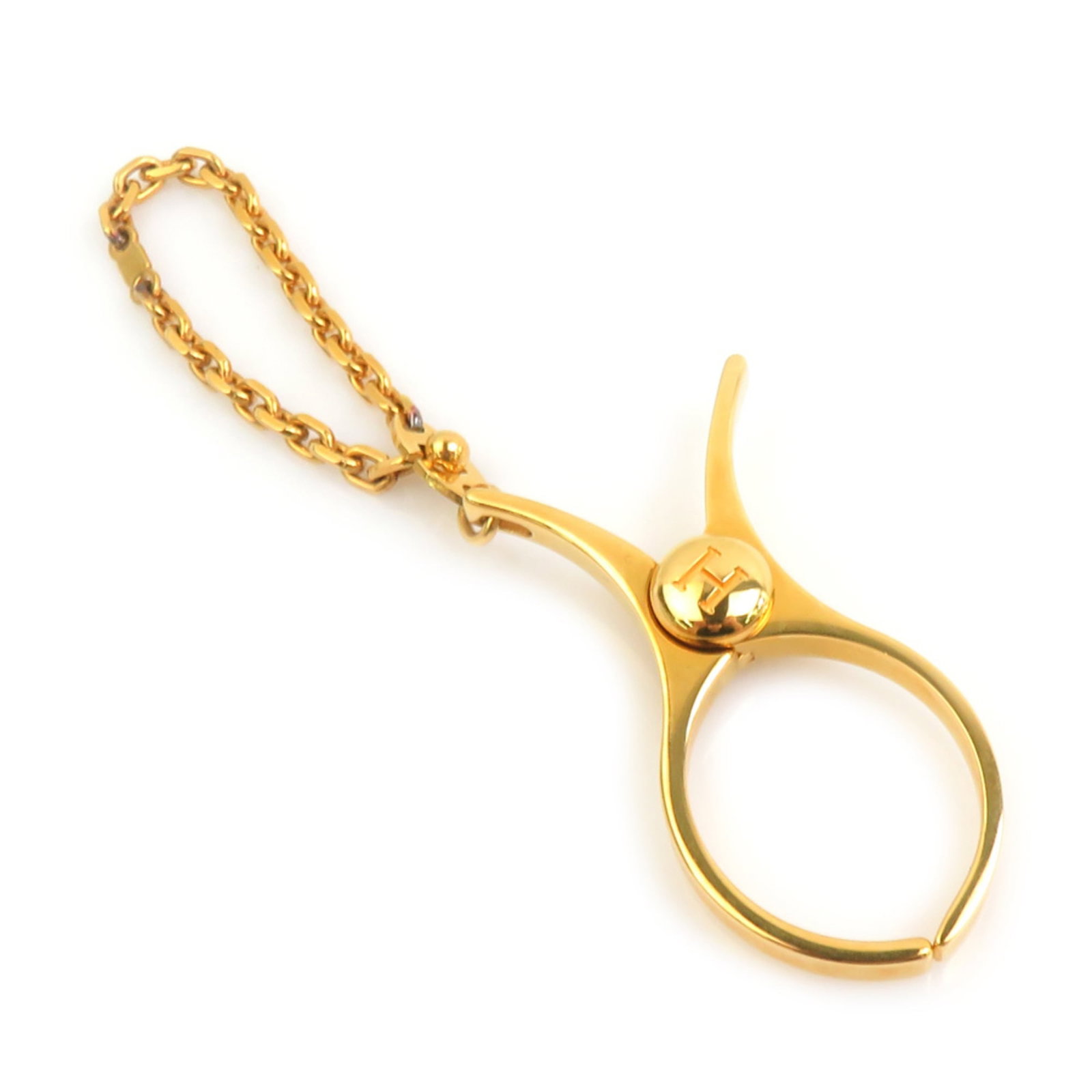 Hermes metal handbag charm: Hermes metal handbag charm Gold metal handbag charm from Hermes, measuring 120.00mm x 27.00mm / 4.72'' x 1.06''. This charm bears a signature and showcases the brand's iconic style with its sleek desi