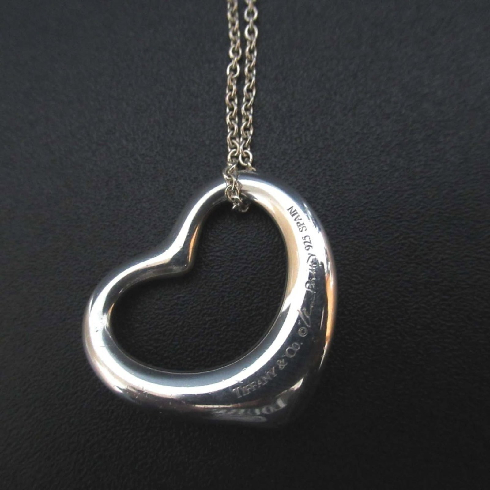 Tiffany and Co Elsa Peretti Pendant in Large Open Heart In 925 Sv Silver For Women: Tiffany and Co Elsa Peretti Pendant in Large Open Heart In 925 Sv Silver For Women Tiffany and Co's Elsa Peretti Pendant in large open heart design features 925 sterling silver construction. The penda
