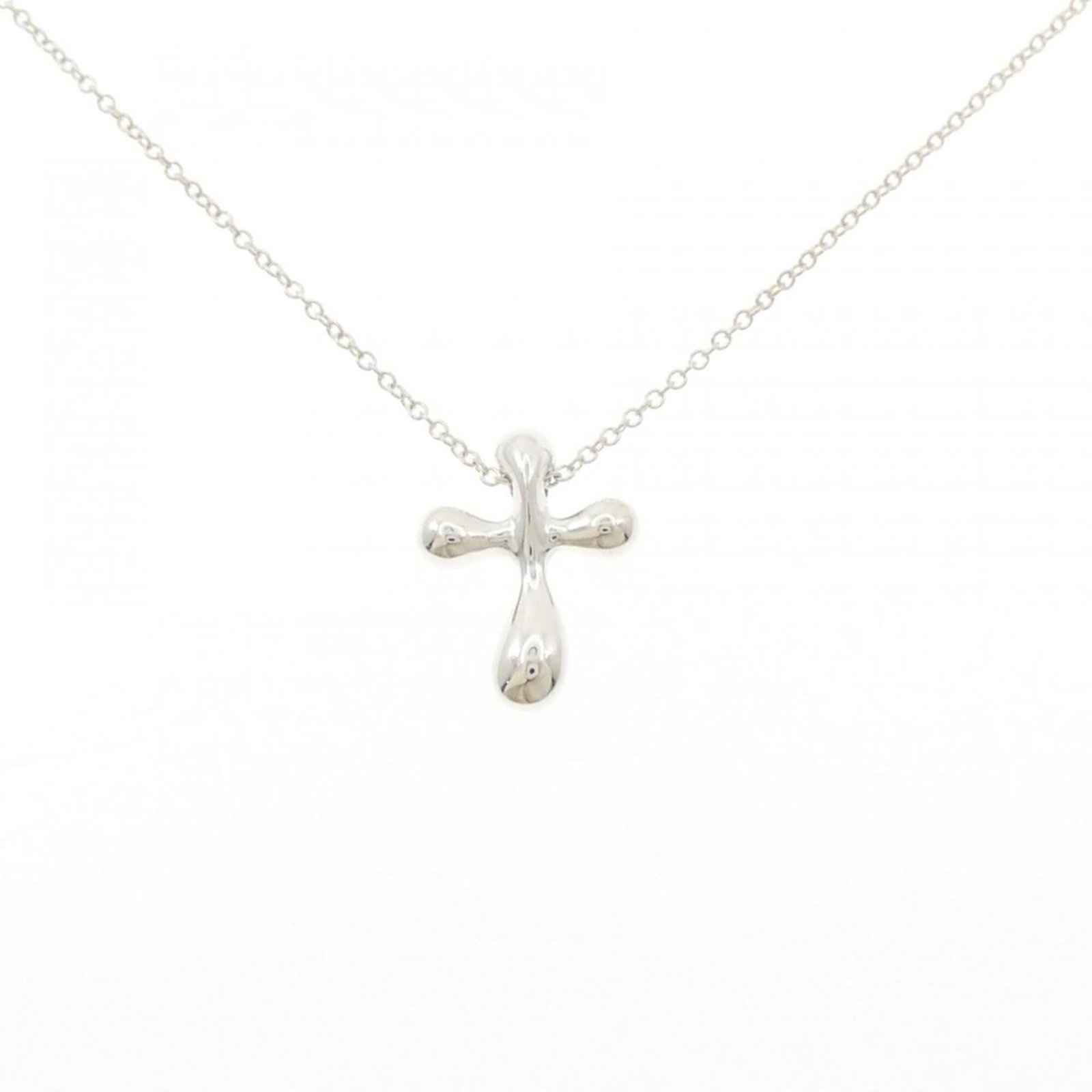 Tiffany Cross necklace: Tiffany Cross necklace Silver Tiffany Cross necklace with pendant size 16mm x 12.2mm, set in a 41 cm / 16.14'' adjustable neck circumference, crafted from high-quality 925 silver material. This