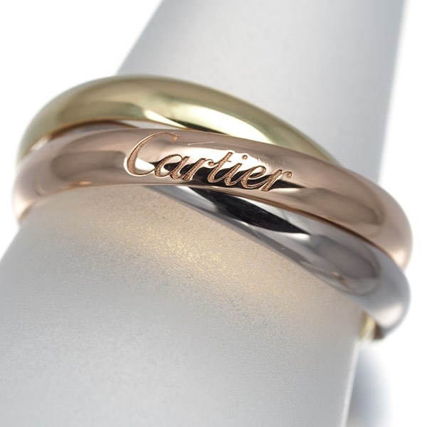 Cartier Ring Trinity 3Color Sm Eu50 18K 750 Yellow White Rose Gold: Cartier Ring Trinity 3Color Sm Eu50 18K 750 Yellow White Rose Gold Cartier's Trinity ring boasts a striking multi-tone design, featuring 18k yellow, white, and rose gold. This elegant ring showcases t