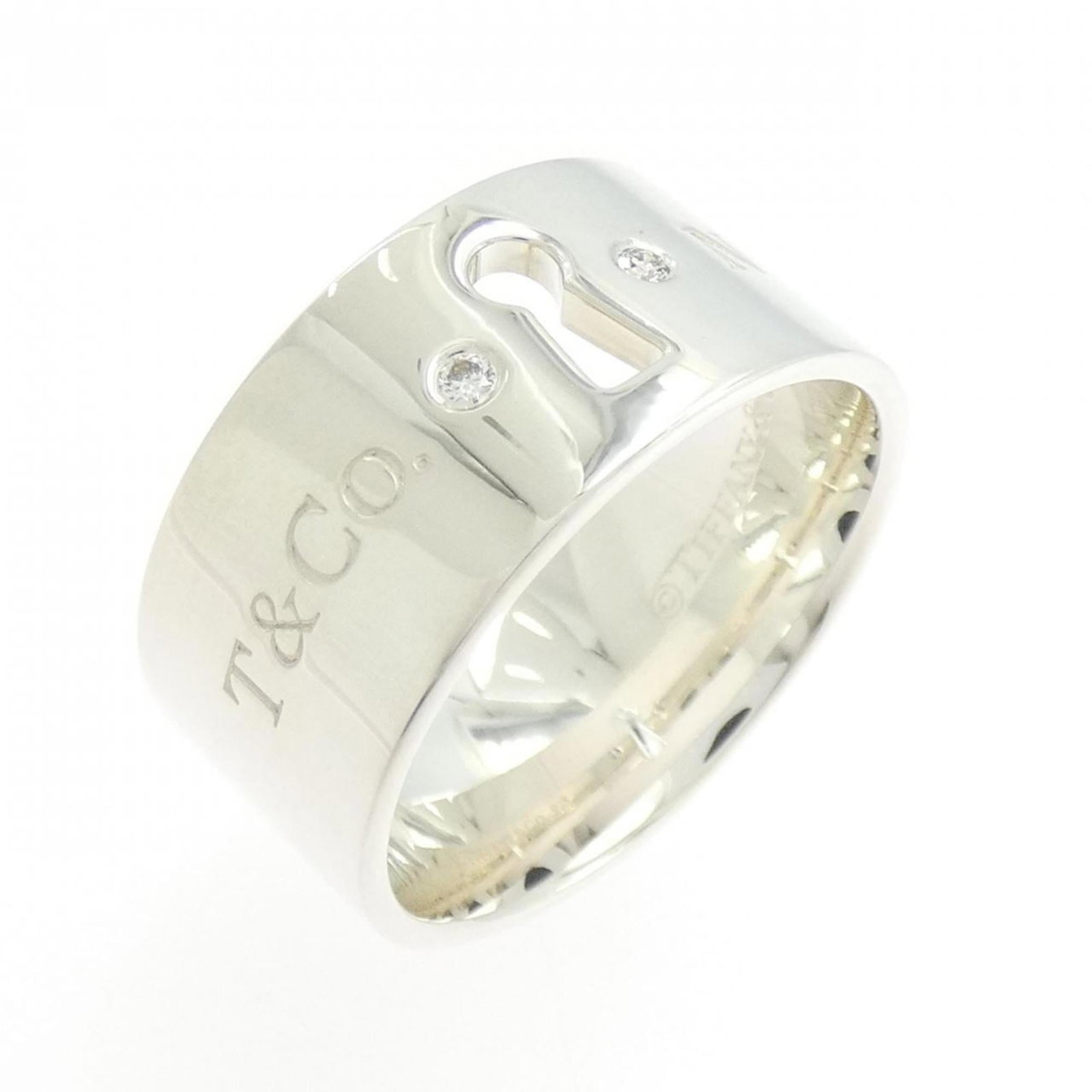 Ring Tiffany Band: Ring Tiffany Band Silver Tiffany band ring with diamond stone, US size 7 and width of 9.4mm, weighing 7.7g. This elegant ring features a high-quality silver925 metal construction and a striking diamon