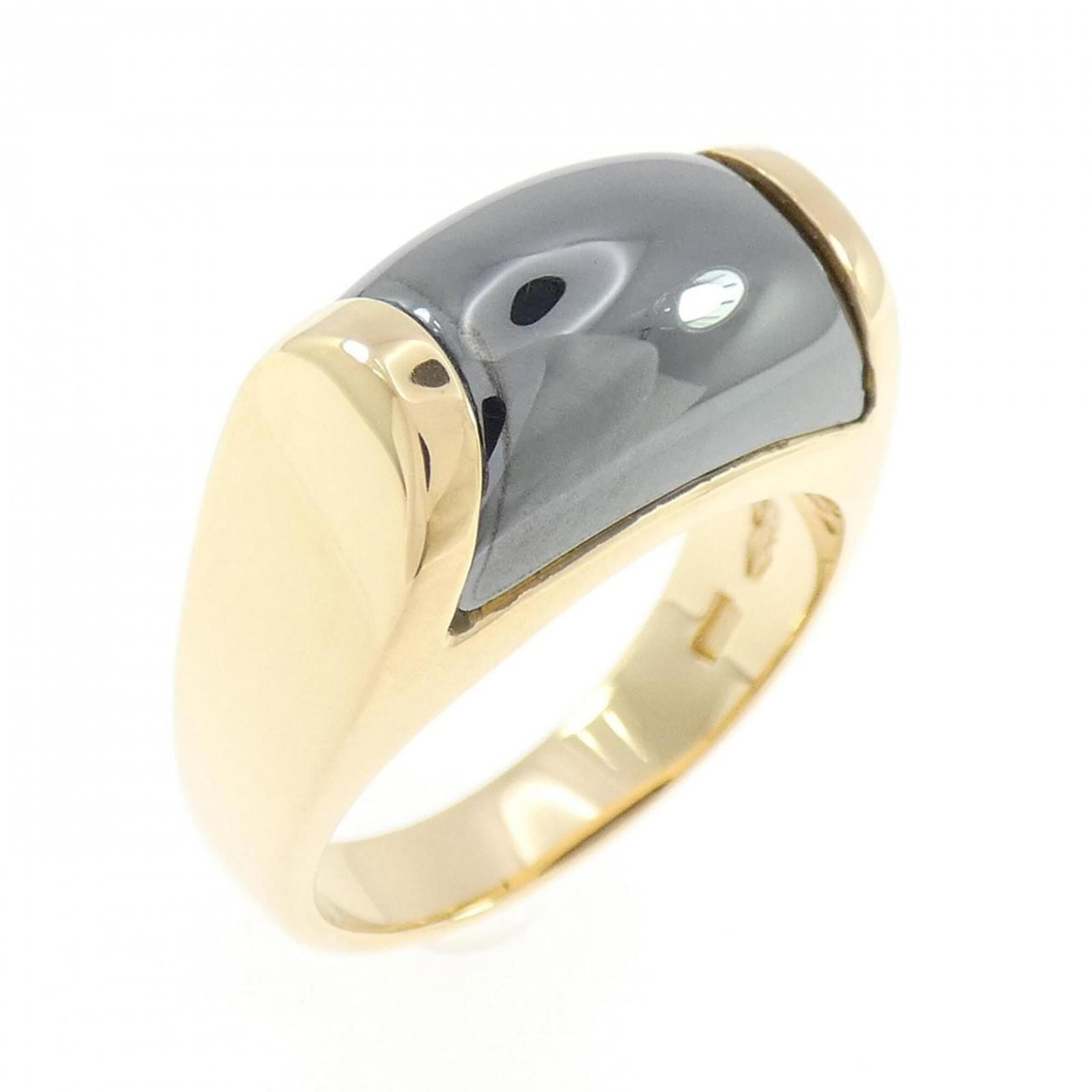 Bvlgari Band Ring Yellow Gold (18K): Bvlgari Band Ring Yellow Gold (18K) Yellow gold (18K) band ring from Bvlgari, featuring hematite stone. This women's ring boasts elegant design and premium yellow gold material. US size 6.5. Item Spec