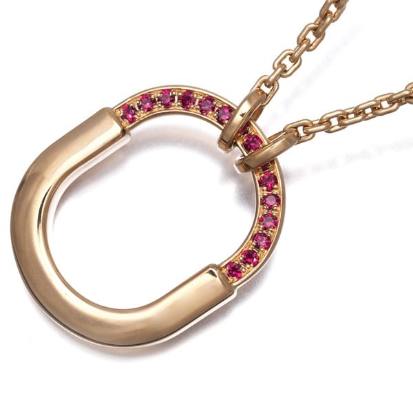 Ruby Lock Tiffany&Co Small 750 18K Rose Gold Necklace: Ruby Lock Tiffany&Co Small 750 18K Rose Gold Necklace Tiffany & Co.'s Small 750 18K Rose Gold Necklace showcases a stunning natural ruby pendant, expertly crafted in 18K rose gold. The necklace featur