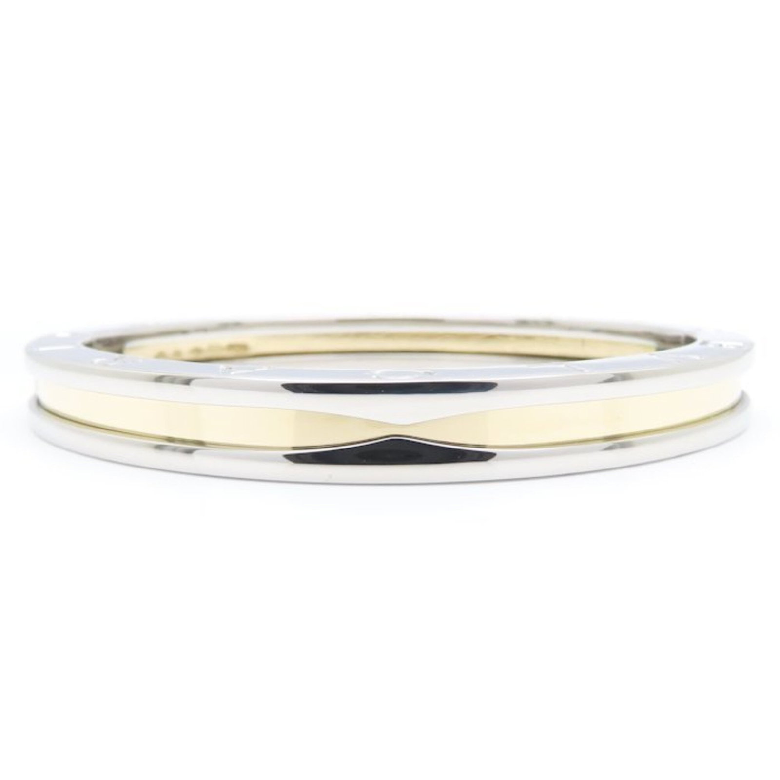 Bvlgari Bangle Stainless Steel Yellow Gold 18k: Bvlgari Bangle Stainless Steel Yellow Gold 18k Stainless steel and yellow gold (18K) come together in this elegant Bvlgari bangle, designed with a sleek 16cm length and slim 7.1mm width. The 26.7g wei