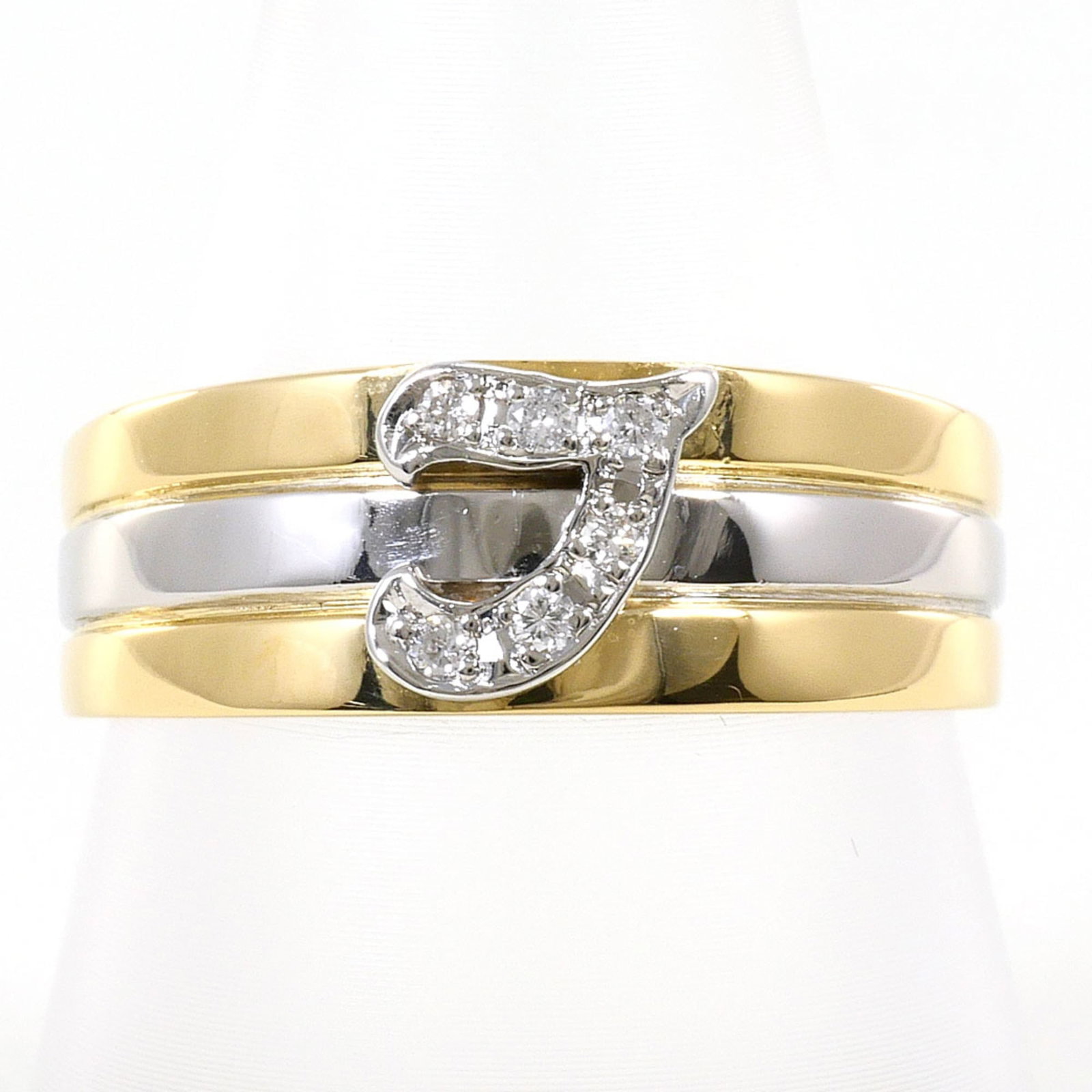 Unbranded Platinum Gold 18K Yellow Ring Band: Unbranded Platinum Gold 18K Yellow Ring Band Platinum and yellow gold come together in this elegant 18K band ring, featuring a diamond stone weighing 0.06 carats. The ring's platinum core provides a s