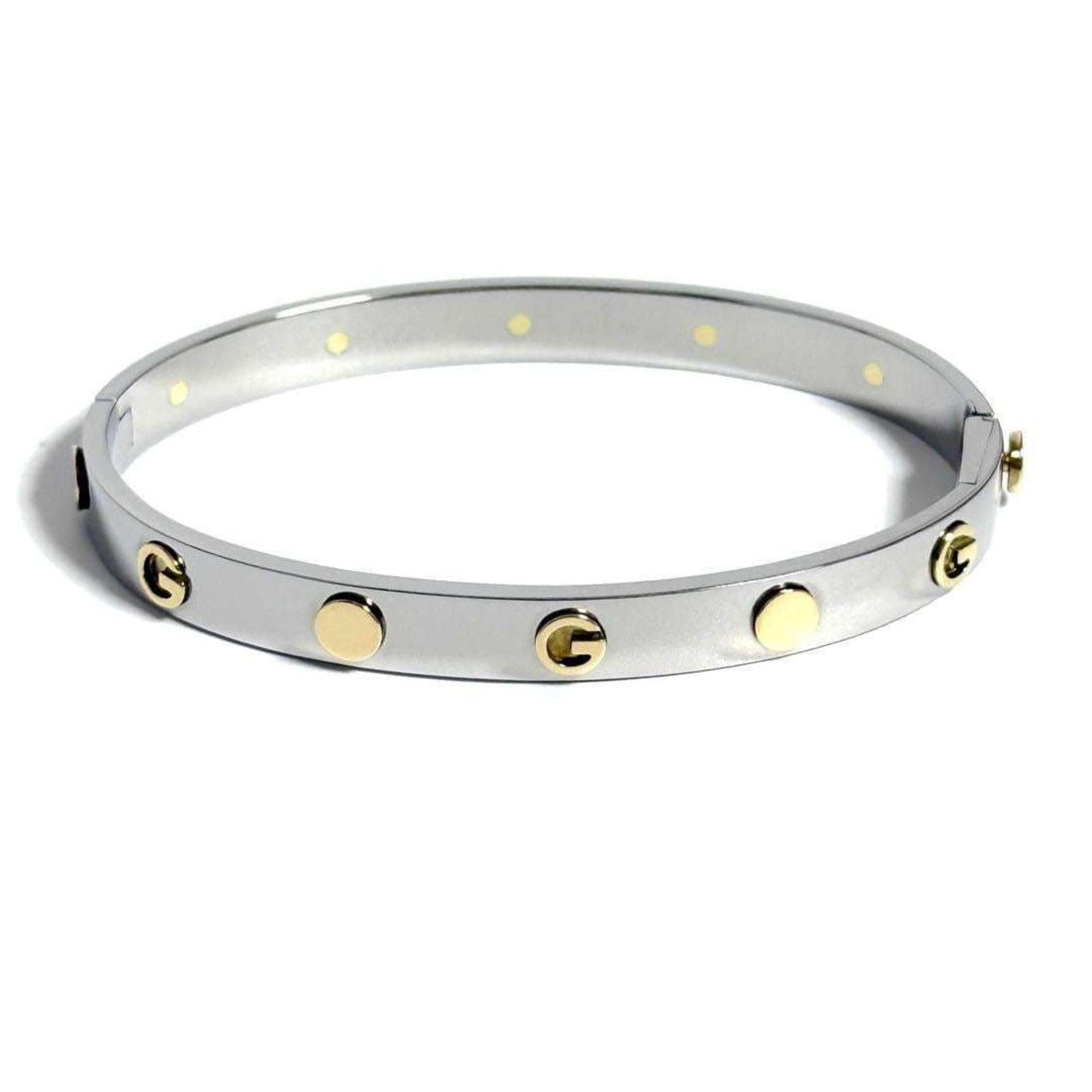 Gucci Bangle Stainless Steel: Gucci Bangle Stainless Steel Stainless steel bangle from Gucci, measuring 17cm in length. This simple yet elegant accessory features the iconic brand's signature style. Made from durable stainless