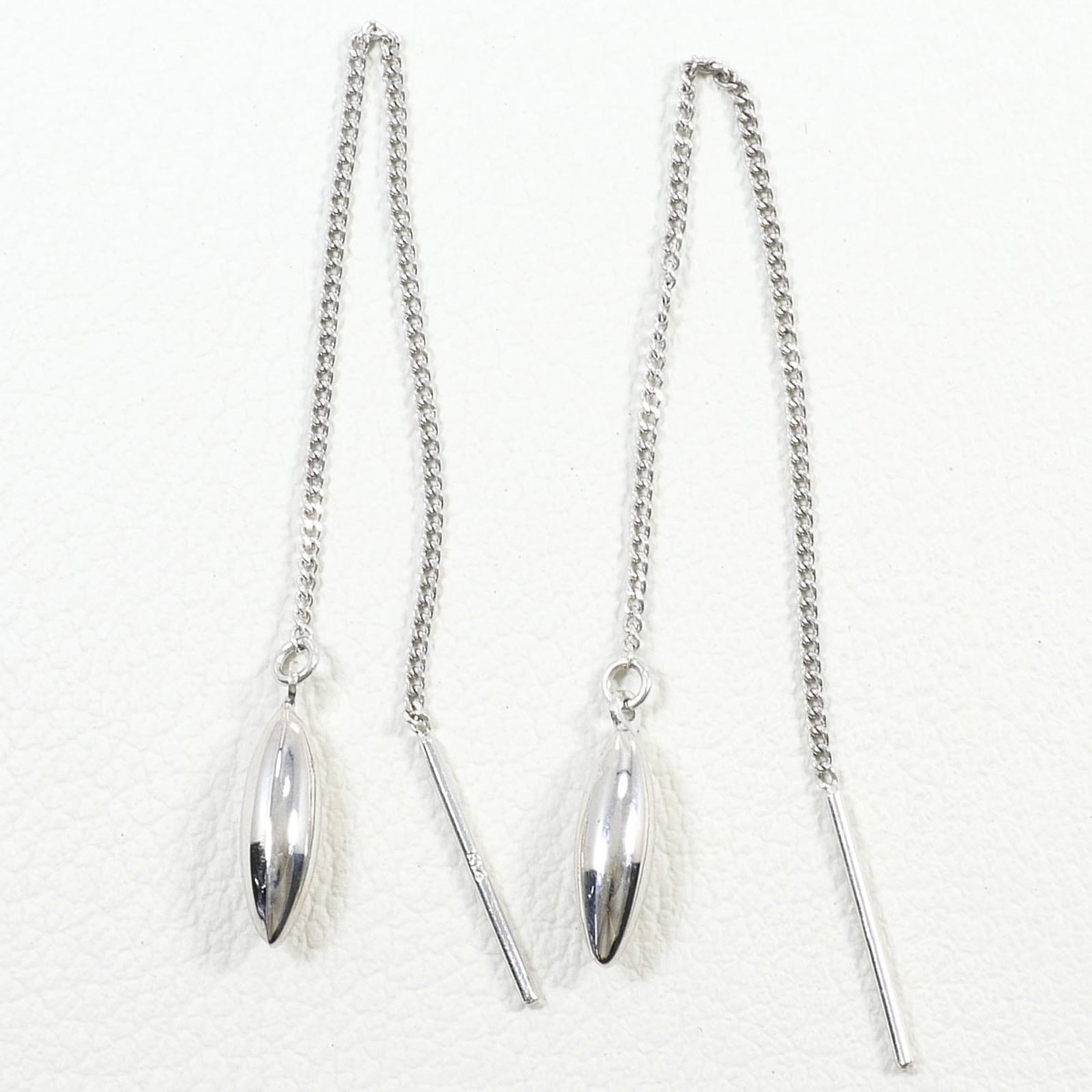 Unbranded Chain Earrings White Gold (14K): Unbranded Chain Earrings White Gold (14K) Chain earrings made from unbranded white gold (14K) metal, weighing 0.6g / 0.02oz, are available in this listing. The item features a chain design, crafted