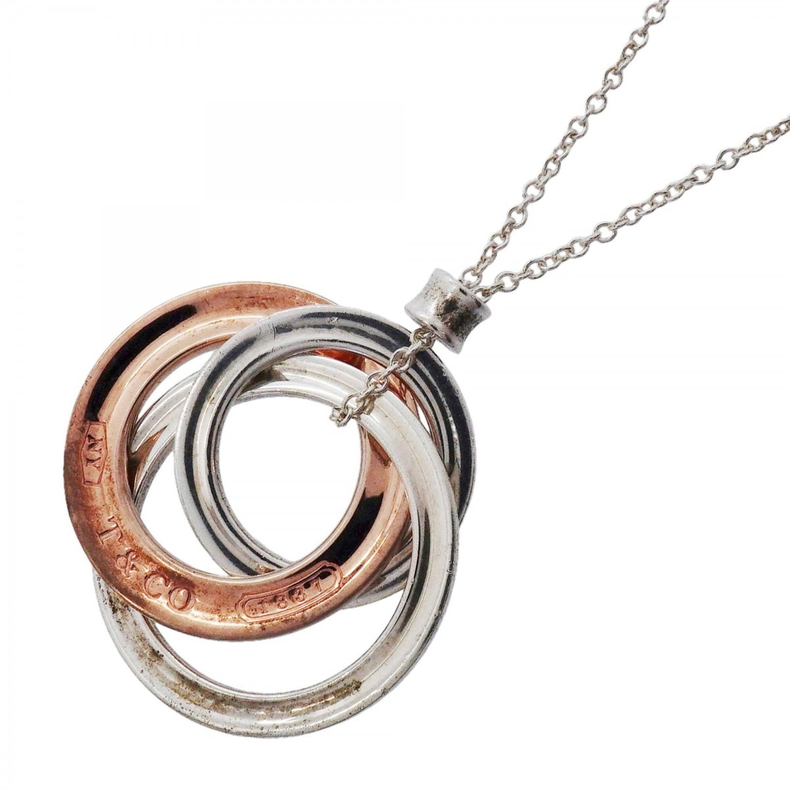 Sterling Silver Interlocking Rubedo 925 Tiffany Women's 1837 Necklace: Sterling Silver Interlocking Rubedo 925 Tiffany Women's 1837 Necklace Item Specifics: Brand: Tiffany Necklace Type: Necklace Gender: Women Material: Silver 925 Neck Circumference: 44 cm / 17.32'' Pend