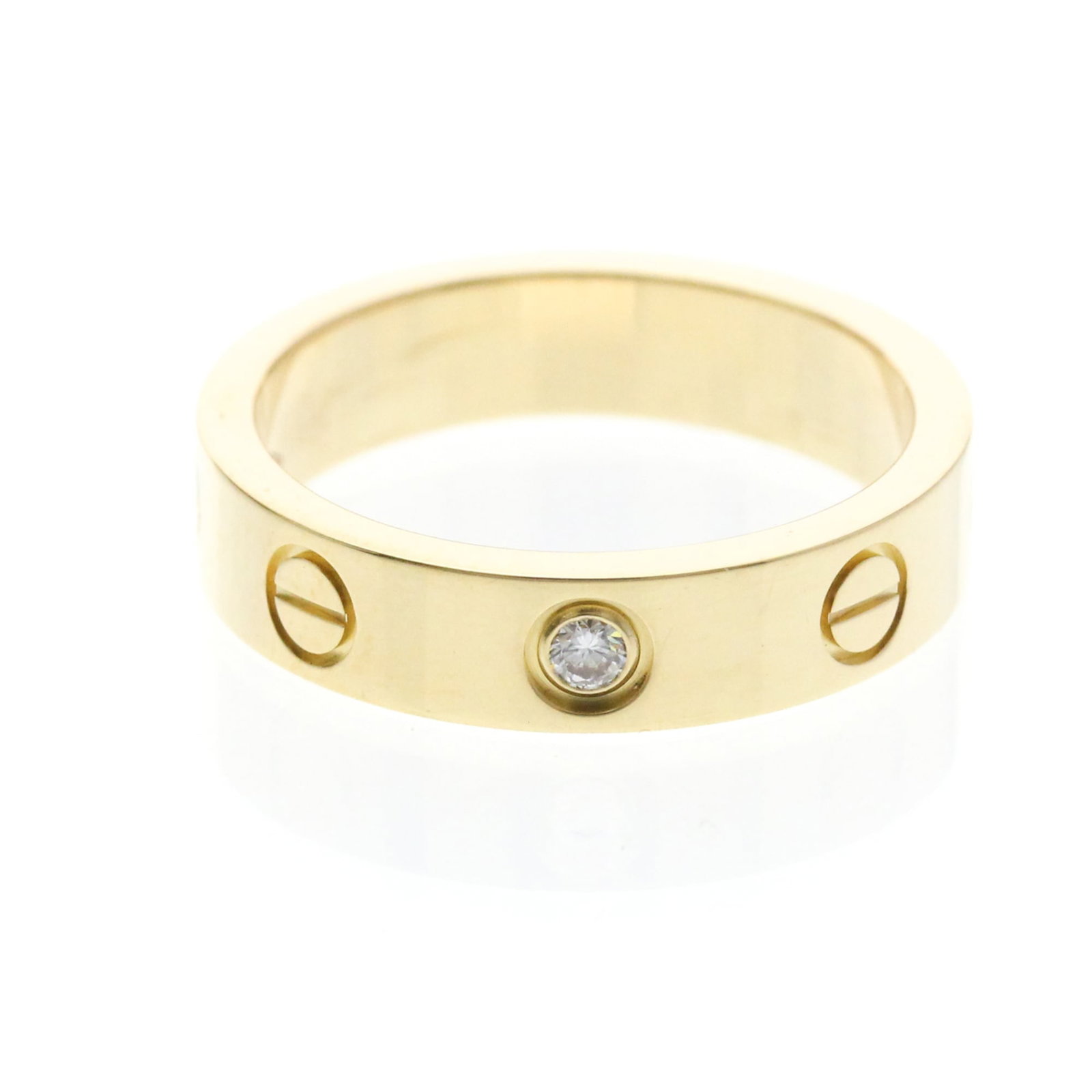 Yellow Gold Cartier 18K Ring: Yellow Gold Cartier 18K Ring Yellow gold Cartier Mini Love Ring with diamond. This 18K band ring features a 4mm diamond and weighs 4.3g, making it a delicate yet elegant accessory. The ring's yellow g