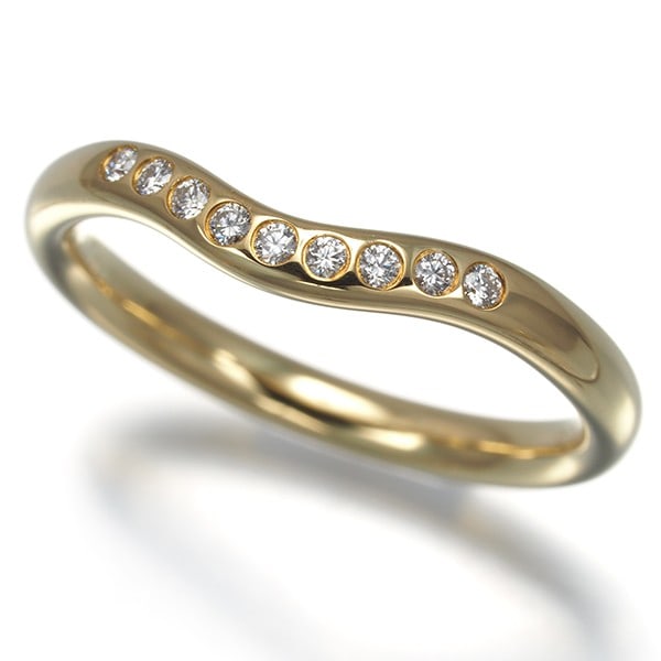 Tiffany&Co. Ring Diamond Curved Band 9P Us5 18K 750 Yellow Gold: Tiffany&Co. Ring Diamond Curved Band 9P Us5 18K 750 Yellow Gold Tiffany & Co.'s iconic curved band features a natural diamond set in 18k yellow gold, creating a timeless and elegant design. The ring's