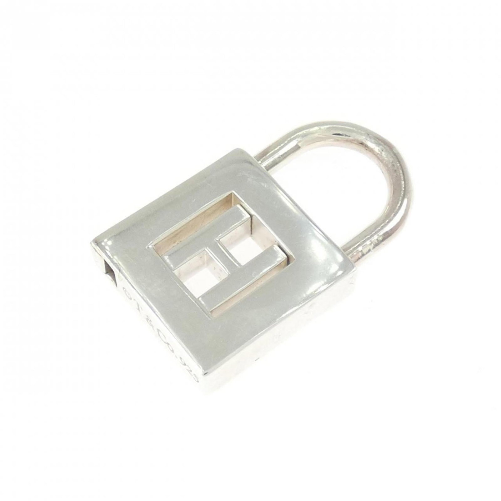 Rock charm pendant by Tiffany: Rock charm pendant by Tiffany Silver 925 pendant by Tiffany, measuring 22.6mm x 13.4mm, features a unique design that showcases the brand's craftsmanship. Made from high-quality silver, this pendant i