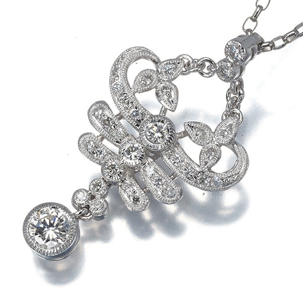 Milgrain 0.67Ct Diamond Necklace 900 850 Platinum: Milgrain 0.67Ct Diamond Necklace 900 850 Platinum 900/850 Platinum Milgrain Diamond Necklace showcases a stunning 0.67ct diamond pendant, perfectly complemented by two smaller bottom diamonds. The nec
