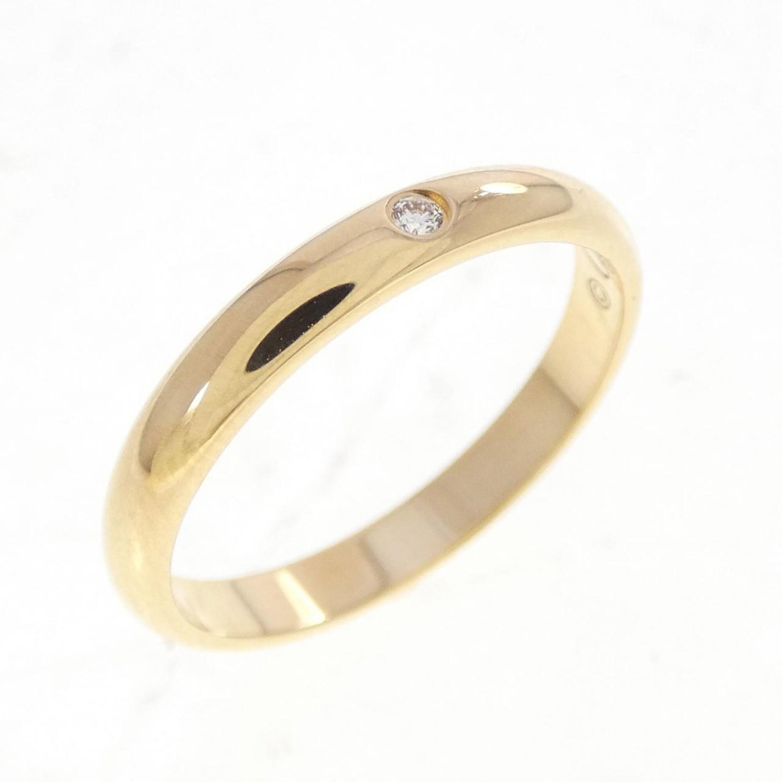 Yellow Gold Cartier 18K Ring: Yellow Gold Cartier 18K Ring Yellow gold Cartier ring boasts an elegant design with diamond stone, available in US size 5. The 18K yellow gold band features a classic style that suits women's