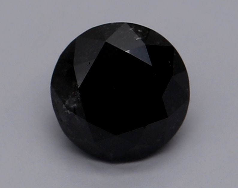 GIA Round 0.84ct Fancy Black VVS2 - Loose Natural Diamond: GIA Round 0.84ct Fancy Black VVS2 - Loose Natural Diamond Round 0.84ct Fancy Black VVS2 diamond with EX polish and symmetry, certified by the Gemological Institute of America (GIA). This natural