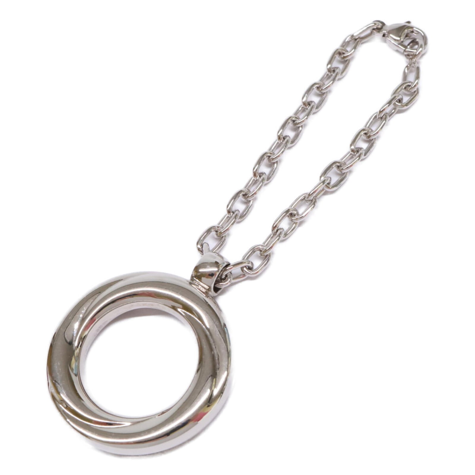 Metal Cartier Charm Handbag: Metal Cartier Charm Handbag Silver Metal Cartier Charm Handbag. This metal handbag charm features the iconic Cartier brand and boasts a sleek, silver finish. A stylish accessory for those who apprecia
