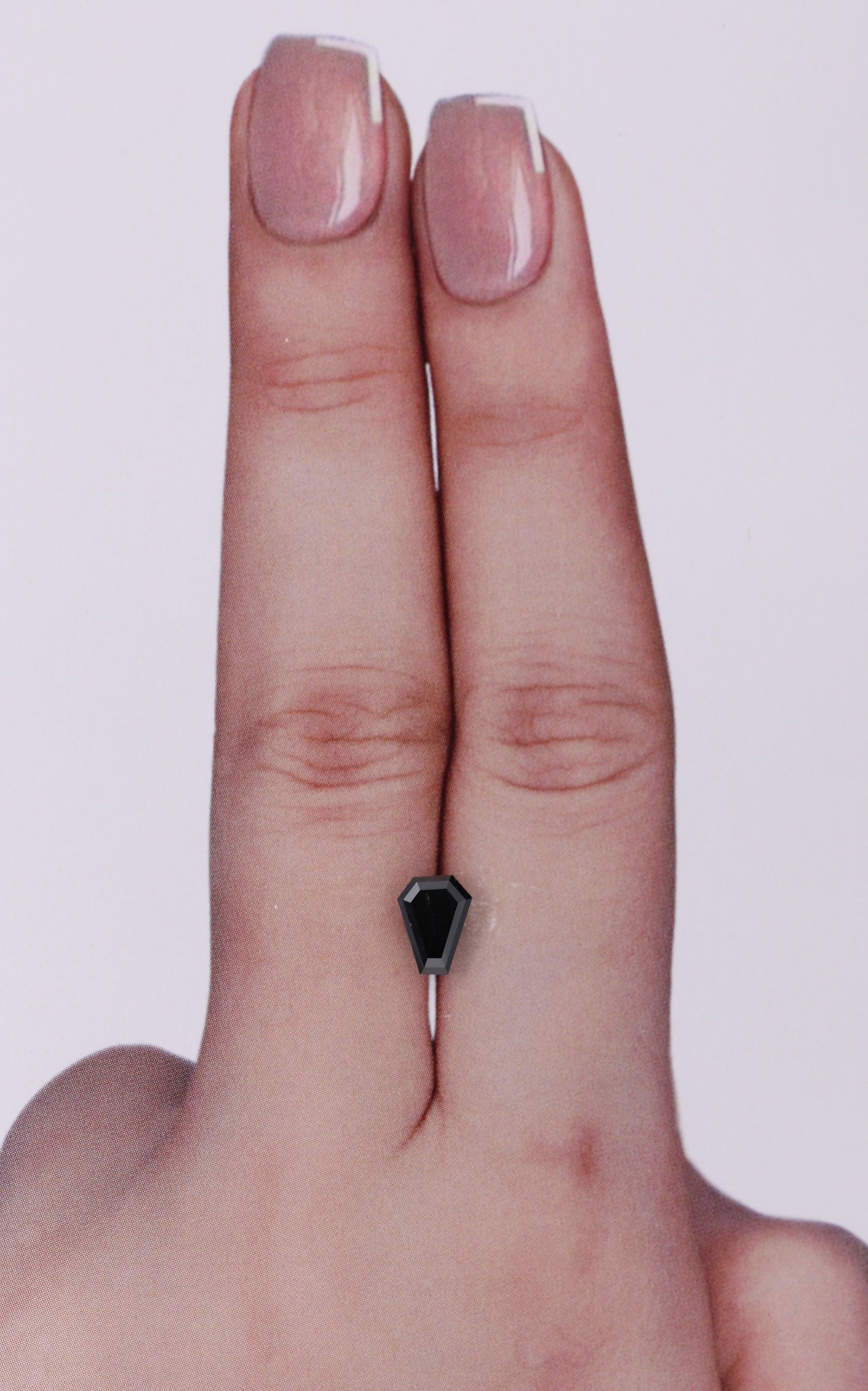 Calf 0.67ct Fancy Black VVS2 - Loose Natural Diamond: Calf 0.67ct Fancy Black VVS2 - Loose Natural Diamond 0.67ct Fancy Black VVS2 - Loose Natural Diamond, showcasing exceptional clarity and polish with its EX symmetry and EX polish, set in a unique natu