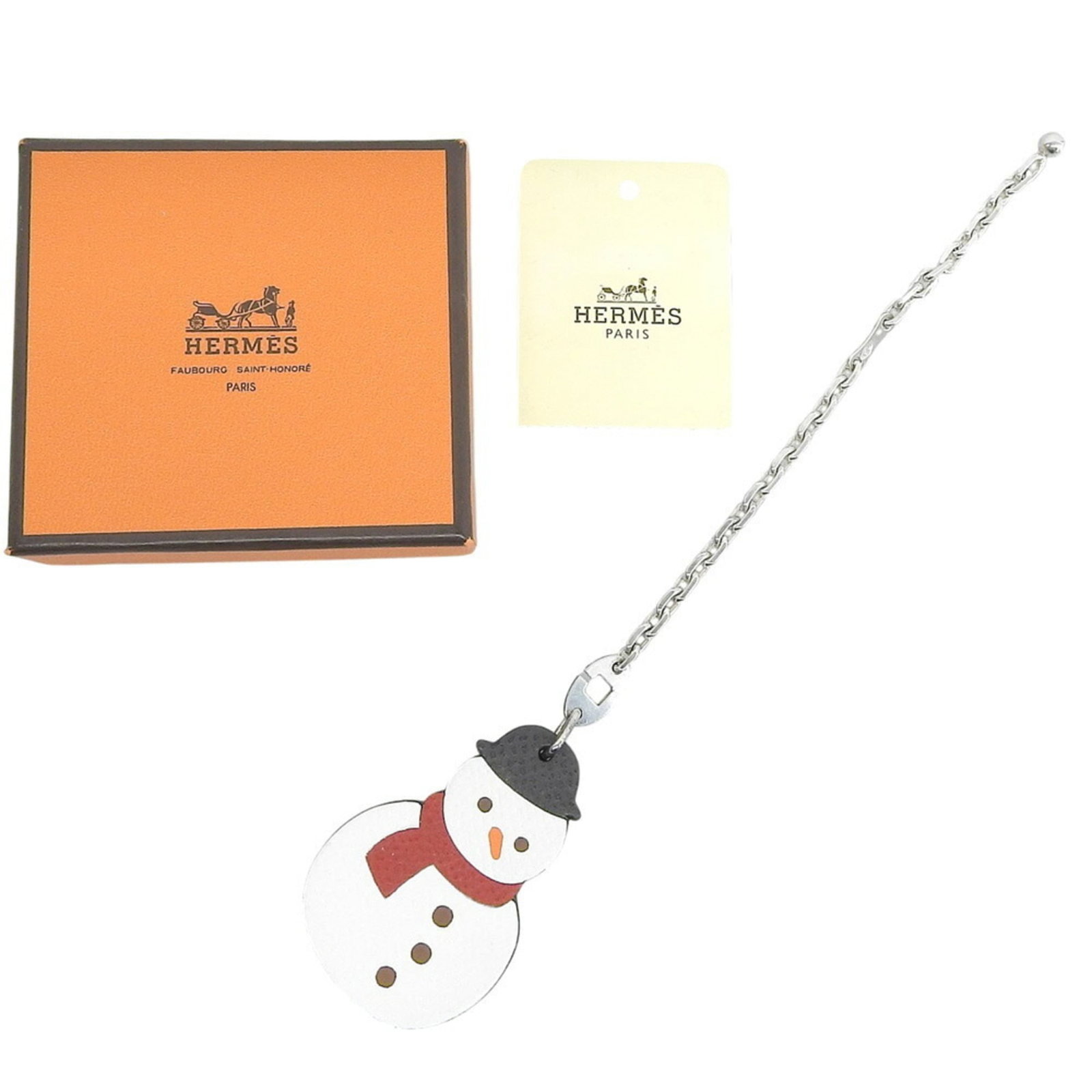 Hermes Handbag Charm Leather Silver 925: Hermes Handbag Charm Leather Silver 925 Silver and white leather charm from Hermes, made with 925 silver. This small accessory measures 120mm x 35mm x 4.72'' x 1.38''. The charm bears a signature,