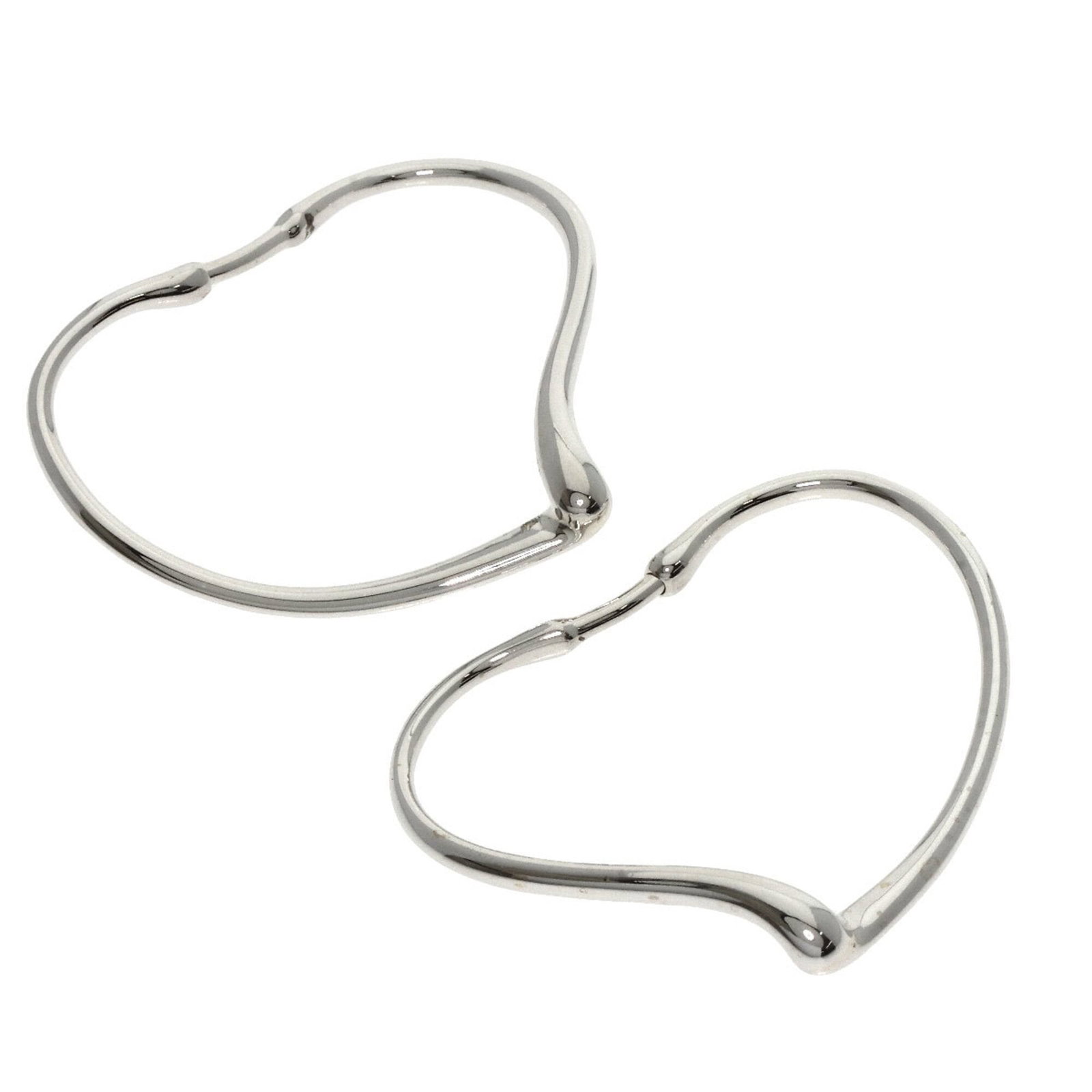 Hoop earrings by Tiffany: Hoop earrings by Tiffany Silver hoop earrings from Tiffany, measuring 30.30mm x 34.50mm and weighing 5.5g, showcase the brand's signature style with a sleek open heart design. Made from high-quality s