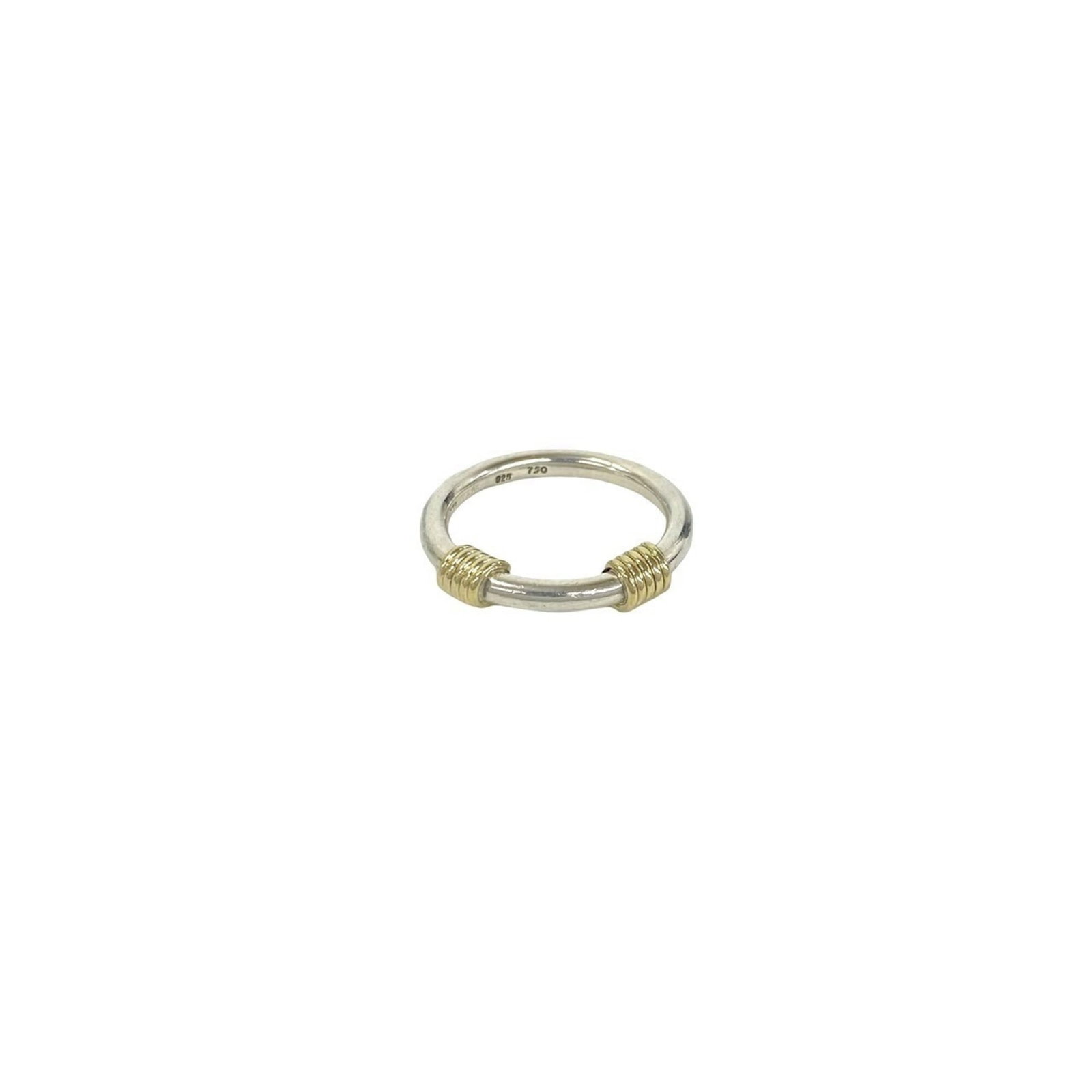 Tiffany Band Ring Silver 925 Yellow Gold (18K): Tiffany Band Ring Silver 925 Yellow Gold (18K) Silver 925 band ring with an 18K yellow gold accent, adding a touch of luxury to any outfit. This elegant piece is available in US size 5.5 and features 