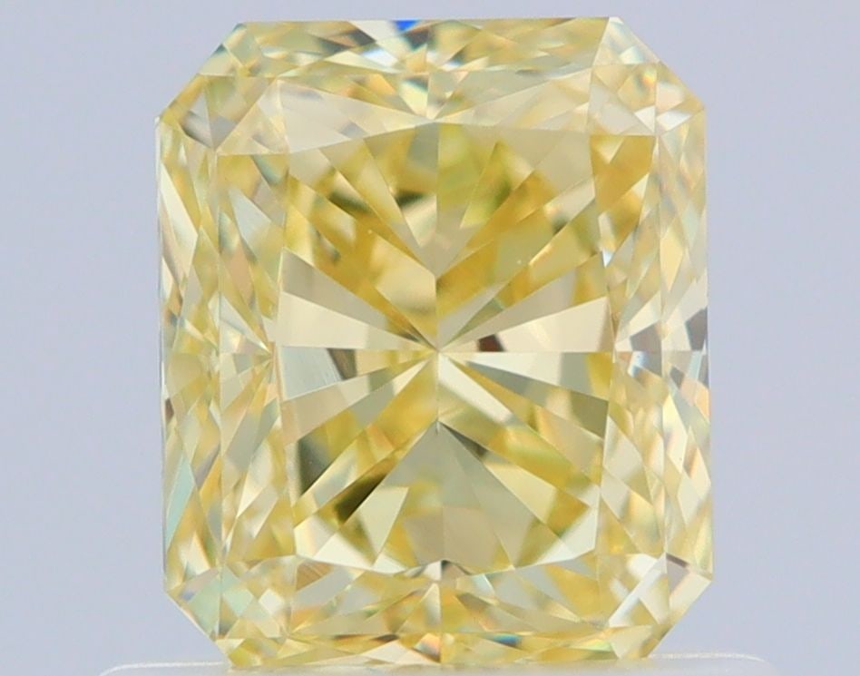 GIA Radiant 0.9ct Fancy Yellow VVS1 - Loose Natural Diamond: GIA Radiant 0.9ct Fancy Yellow VVS1 - Loose Natural Diamond A stunning Fancy Yellow diamond, certified by the Gemological Institute of America (GIA), boasts exceptional clarity and color. Its VVS1 gra