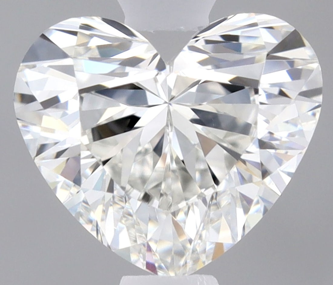 GIA Heart 0.55ct G VVS2 - Loose Natural Diamond: GIA Heart 0.55ct G VVS2 - Loose Natural Diamond GIA-certified, this 0.55ct G VVS2 diamond boasts exceptional clarity and cut quality, with EX polish and symmetry. Measuring 5.0L x 5.77W x 3.26H, its