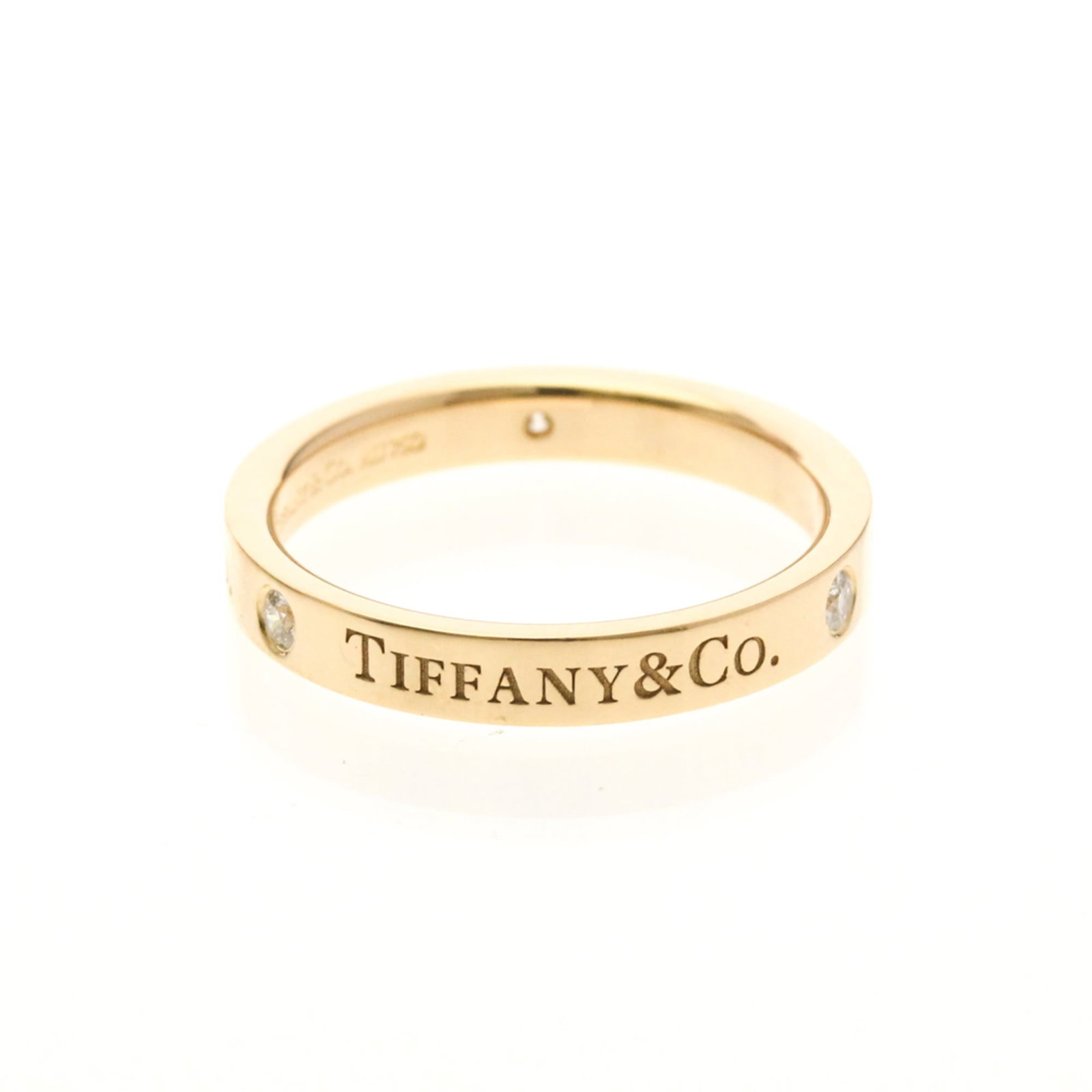 Pink Gold Tiffany Ring Band: Pink Gold Tiffany Ring Band Pink Gold Tiffany Ring Band features a flat band design with 3P diamond type, showcasing the elegance of pink gold (18K) metal. This fashion ring boasts a US size 6 and wid