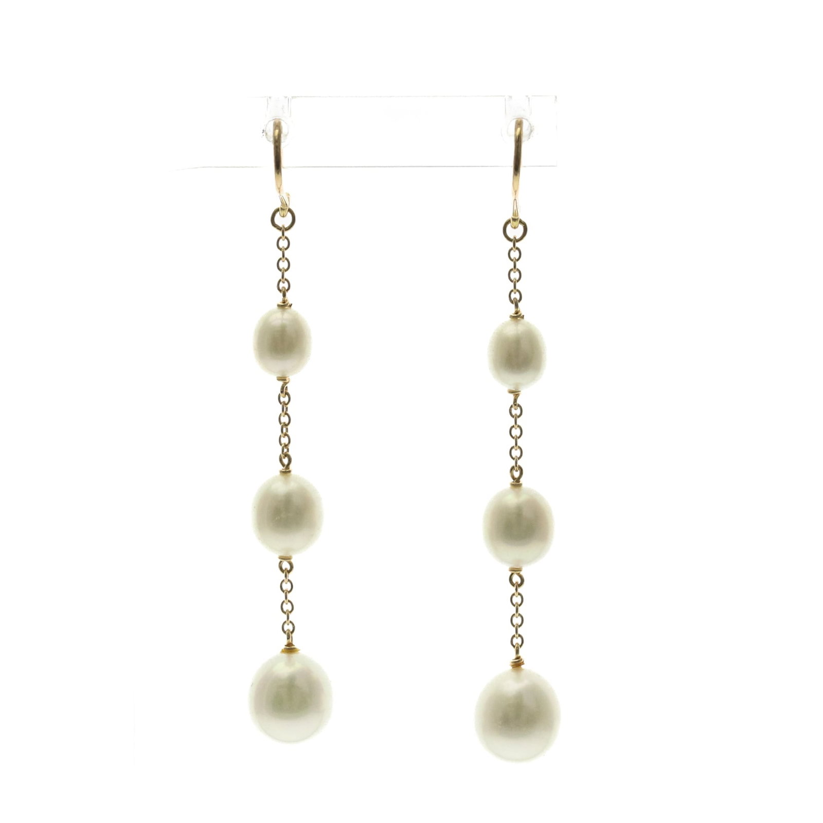 Tiffany Drop Earrings Yellow Gold (18K): Tiffany Drop Earrings Yellow Gold (18K) Yellow gold (18K) Tiffany Drop Earrings are crafted with freshwater pearls, creating a timeless and elegant look. The 45mm x 7.50mm drop earrings showcase the