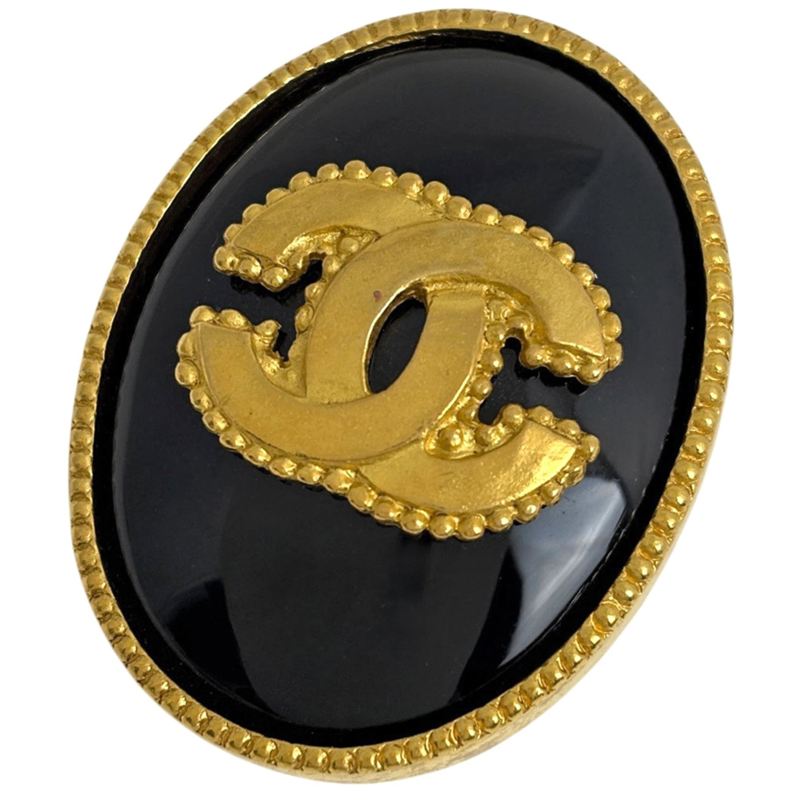 Chanel Brooch: Chanel Brooch Black and gold Chanel brooch with a charm size of 3.2cm x 4.3cm, making it a stylish accessory for women's outfits. This elegant piece features a sleek design that adds a touch of sophis