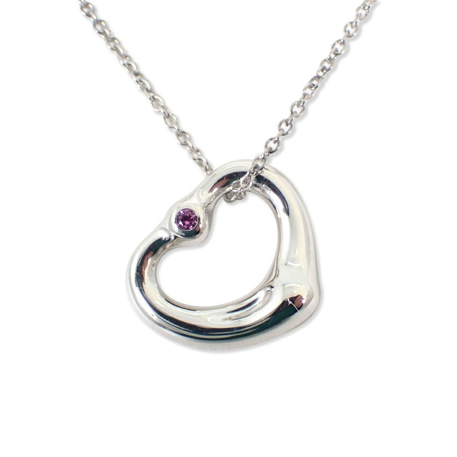 Tiffany 925 Pink Sapphire Heart Pendant Necklace J88-10: Tiffany 925 Pink Sapphire Heart Pendant Necklace J88-10 Sterling silver pendant necklace featuring a beautiful pink sapphire heart, crafted with 925 quality. The pendant measures 16.7mm x 13.1mm and i
