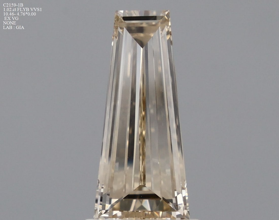 GIA Tapered Baguette 1.02ct Fancy Light Yellow Brown VVS1 - Loose Natural Diamond: GIA Tapered Baguette 1.02ct Fancy Light Yellow Brown VVS1 - Loose Natural Diamond GIA-certified, this loose natural diamond boasts exceptional clarity and color. Its Fancy Light Yellow Brown hue and