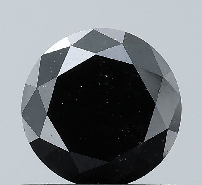Round 0.7ct Fancy Black VVS2 - Loose Natural Diamond: Round 0.7ct Fancy Black VVS2 - Loose Natural Diamond 0.7ct Fancy Black VVS2 - Loose Natural DiamondA rare and striking natural diamond, this round gem boasts an EX cut, VVS2 clarity, and a deep,