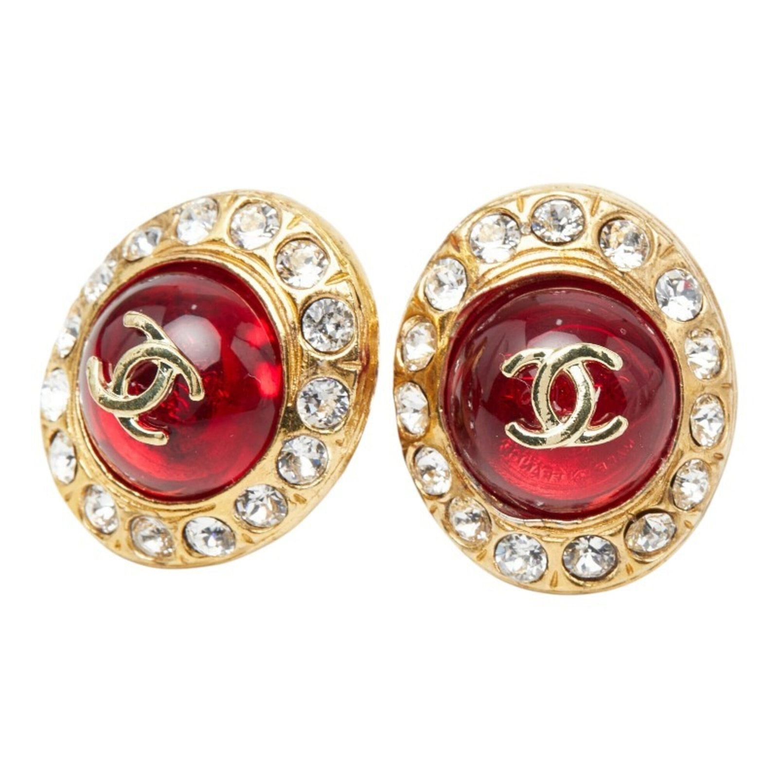 Chanel Clip Earrings Glass: Chanel Clip Earrings Glass Gold and Red Glass Clip Earrings from Chanel. Made from glass, these clip earrings are available in gold and red colors. Standing out with their sleek design and vibrant col