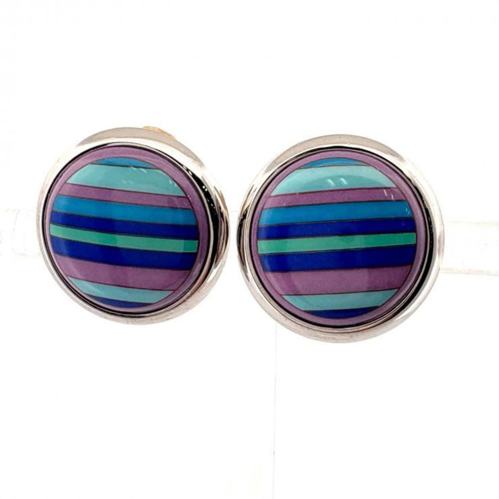 Hermes Clip Earrings: Hermes Clip Earrings Blue Hermes Clip Earrings with a sleek silver finish, measuring 19.00mm x 19.00mm in size. These clip earrings showcase the iconic style of the French luxury brand, featuring a st