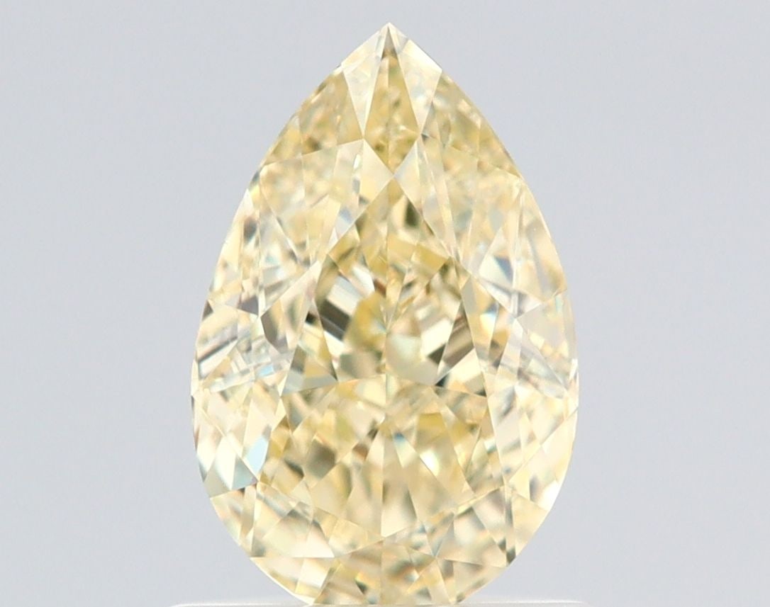 GIA Pear 1.01ct Fancy Light Yellow VVS1 - Loose Natural Diamond: GIA Pear 1.01ct Fancy Light Yellow VVS1 - Loose Natural Diamond GIA-certified, this loose natural diamond boasts exceptional clarity with its VVS1 grade and impressive light yellow color. Measuring 7.