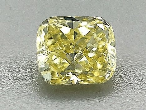 GIA Cushion Brilliant 0.7ct Fancy Yellow VVS2 - Loose Natural Diamond: GIA Cushion Brilliant 0.7ct Fancy Yellow VVS2 - Loose Natural Diamond GIA certified, this loose natural Fancy Yellow diamond boasts exceptional clarity and color. Measuring 5.23 x 4.63 x 3.11mm, it