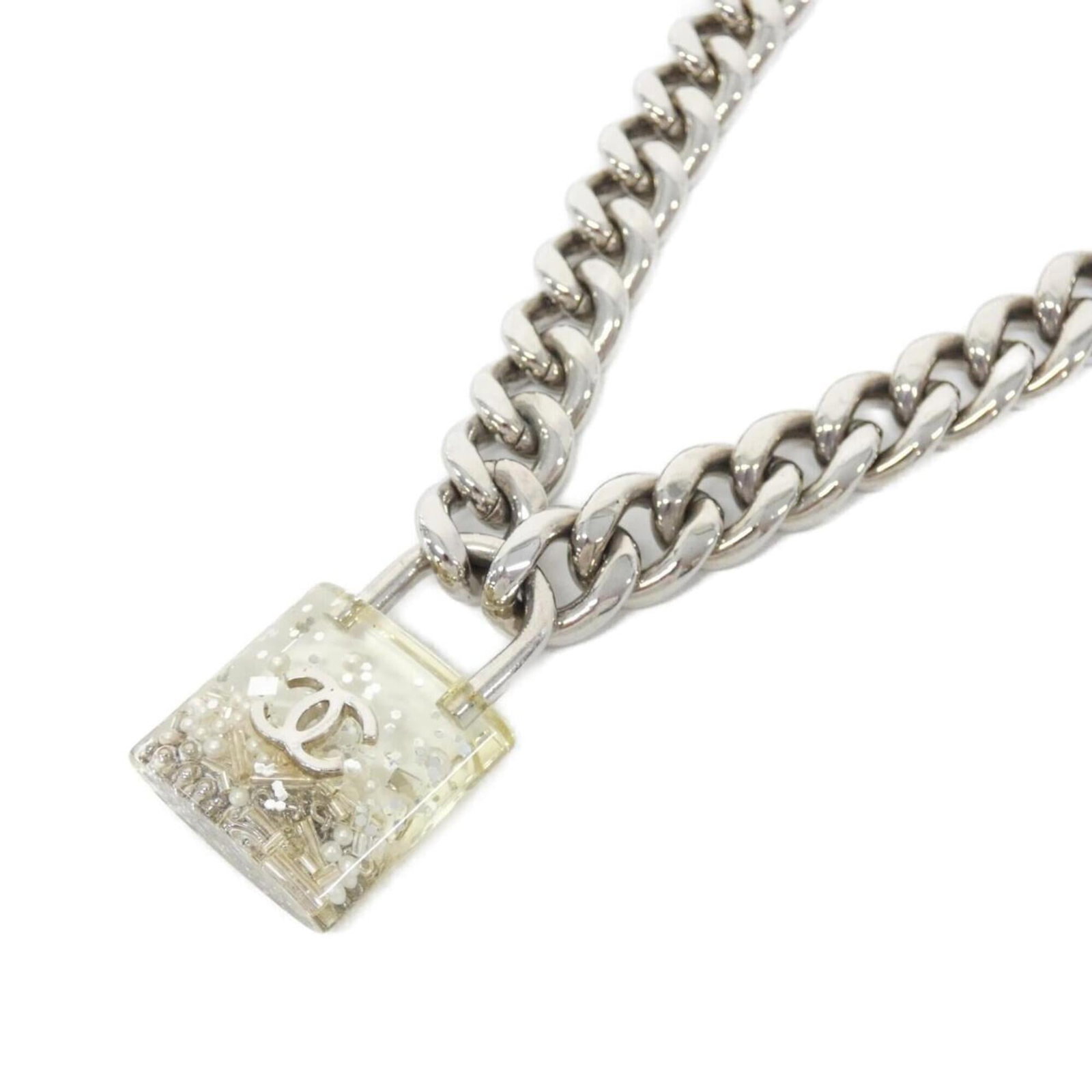 Chanel 88938 Necklace: Chanel 88938 Necklace Clear, White Chanel Necklace with 44mm x 29mm Pendant. This necklace features a clear, white pendant with a signature and measures 62 cm - 70.5 cm in circumference, suitable for 