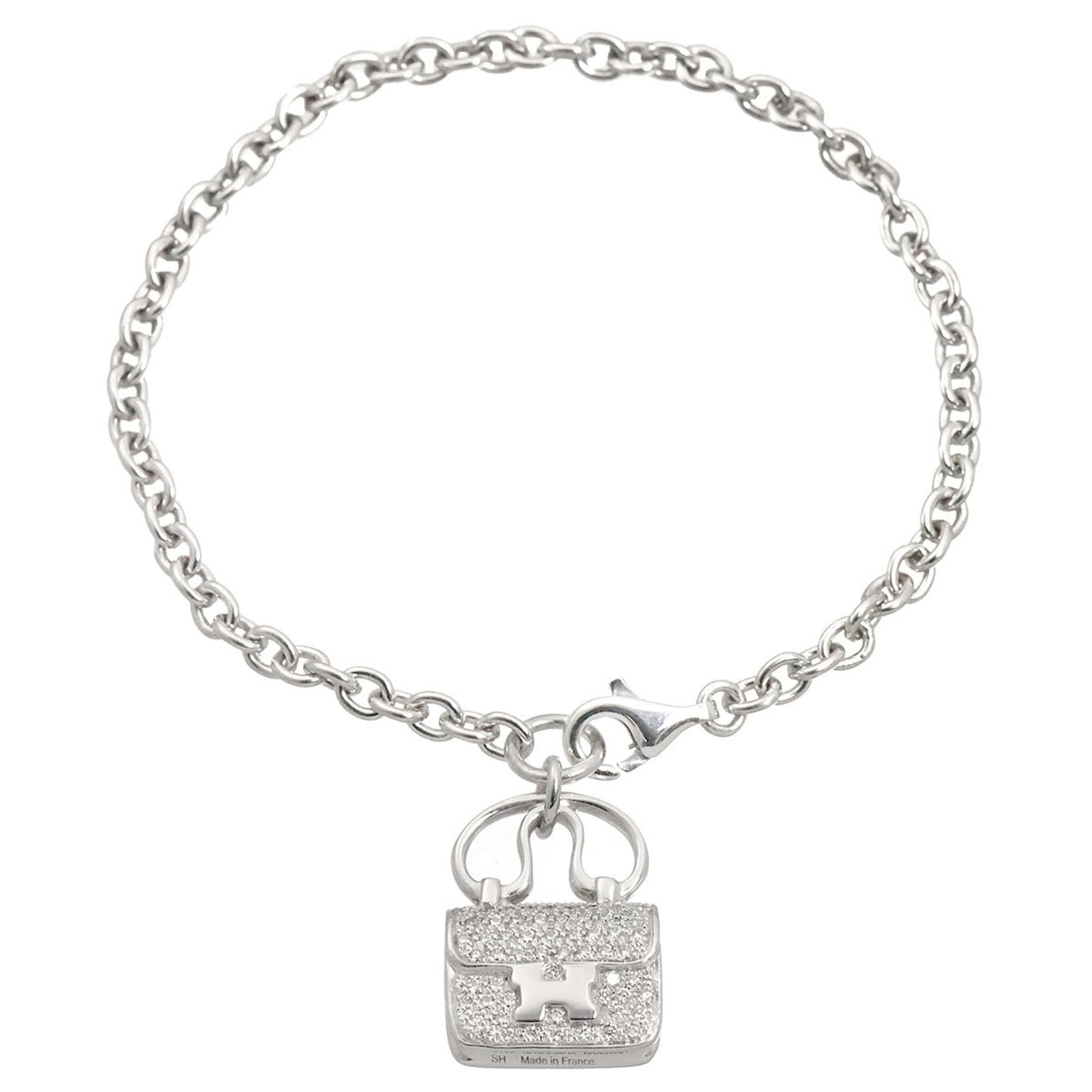 Hermes Charm White Gold 18K: Hermes Charm White Gold 18K White gold (18K) charm bracelet from Hermes, featuring a sleek and elegant design. Measuring 14.5cm in length, this charm bracelet offers a sophisticated accessory for