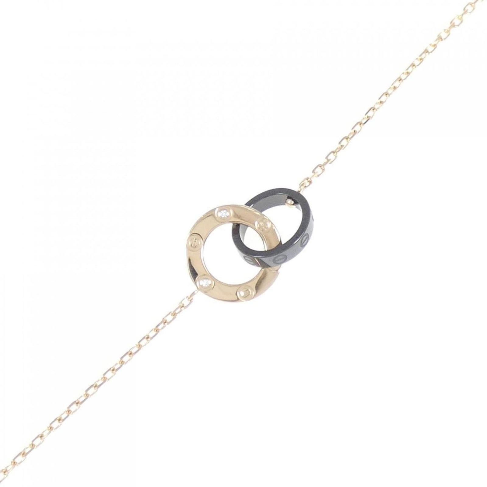 Ceramic Charm Bracelet By Cartier: Ceramic Charm Bracelet By Cartier Ceramic charm bracelet by Cartier, featuring pink stones and diamonds set in gold metal. This 18K ceramic charm bracelet measures 17cm-19.5cm in length and weighs 3.6