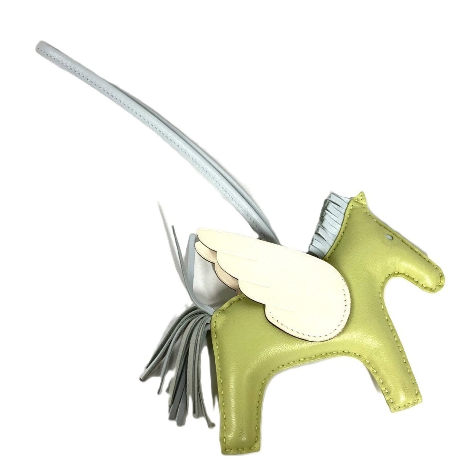 Hermes Charm Handbag Agneau Milo: Hermes Charm Handbag Agneau Milo Agneau Milo, a signature material from Hermes, is used to create the Agneau Milo Handbag. The bag's color options include Green and Ivory. This handbag charm features 