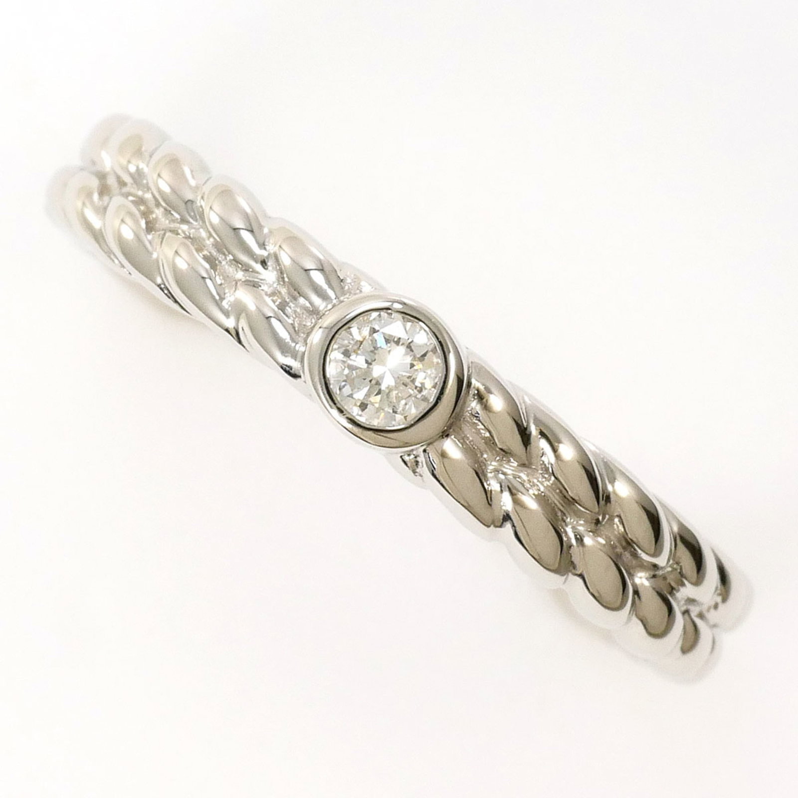 Unbranded Band Ring Platinum 900: Unbranded Band Ring Platinum 900 Platinum 900 band ring features a diamond stone, set in an unbranded platinum metal construction. The ring measures US size 5.5 and has a width of 3mm, weighing approx