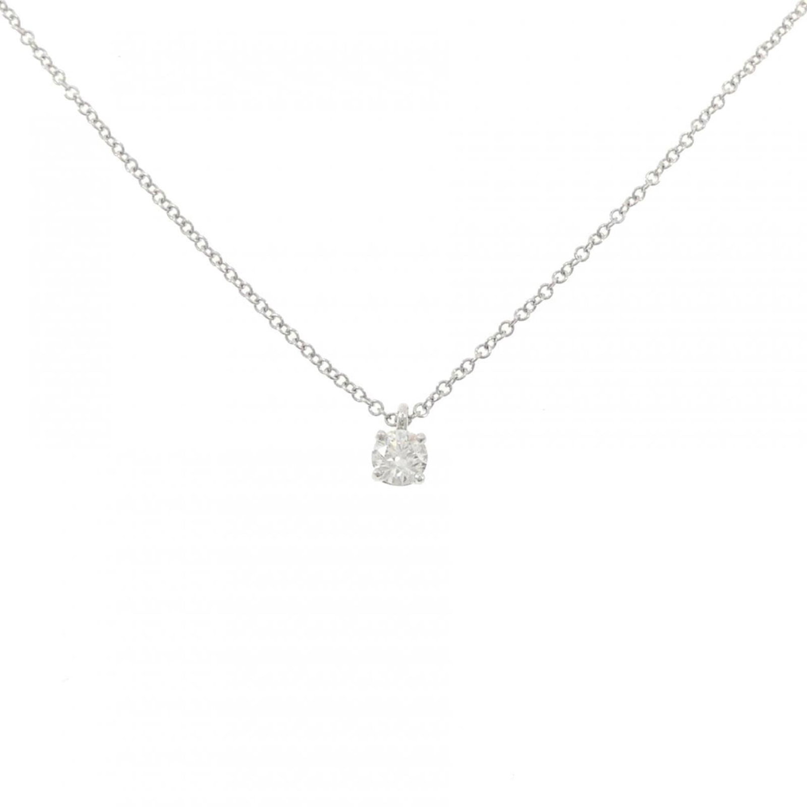 Tiffany & Co. Solitaire Necklace 0.22Ct F Vvs2 3Ext: Tiffany & Co. Solitaire Necklace 0.22Ct F Vvs2 3Ext Tiffany & Co.'s iconic Solitaire Necklace showcases a stunning 0.22 carat F VVS2 diamond, expertly set in platinum. The sleek design features a