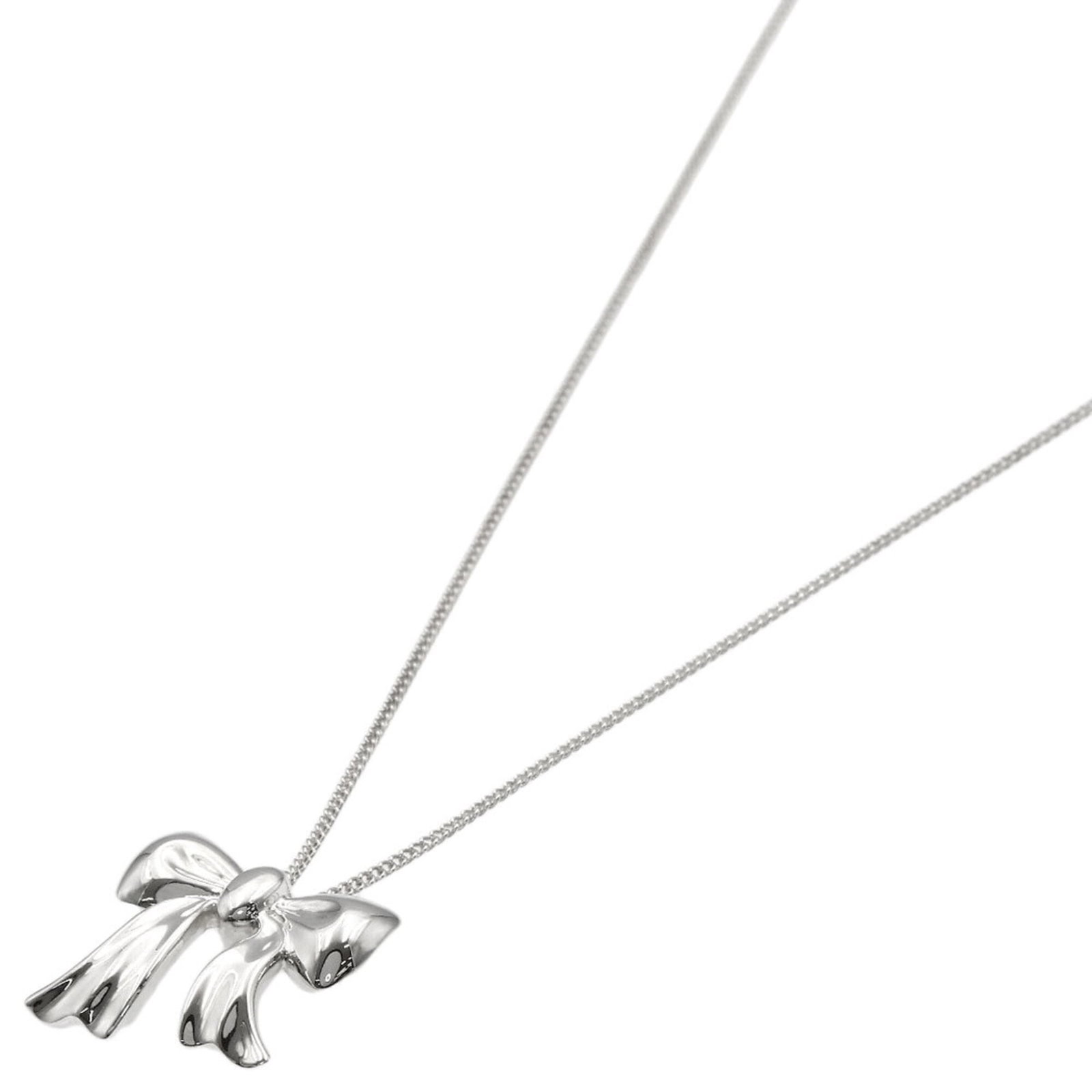 Women's silver ribbon motif necklace by Tiffany & Co.: Women's silver ribbon motif necklace by Tiffany & Co. Silver ribbon motif necklace by Tiffany & Co. features a delicate 14mm x 15.3mm pendant with a 46 cm circumference, set in sterling silver. The