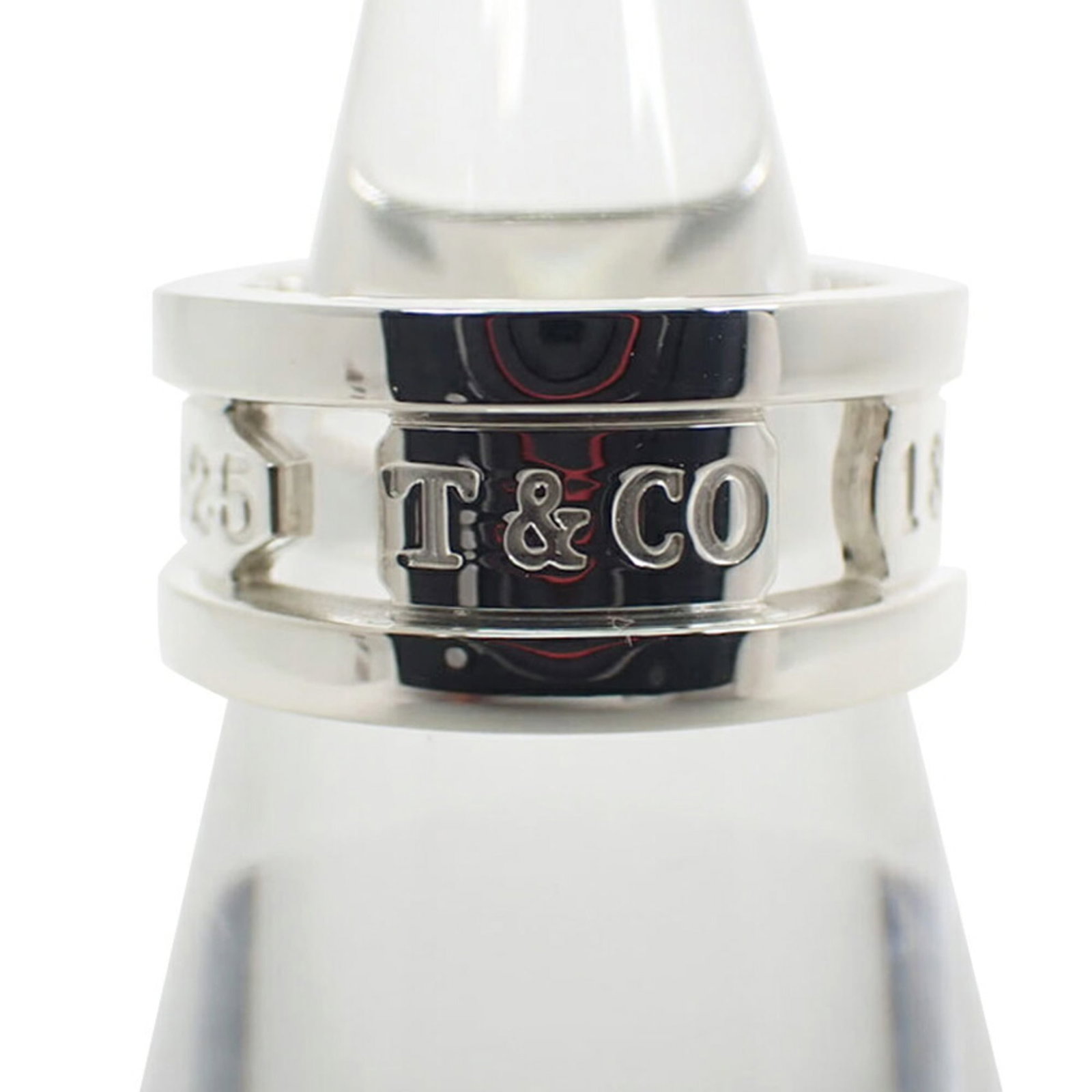 Tiffany Band Ring Sterling Silver 925: Tiffany Band Ring Sterling Silver 925 Sterling silver band ring from Tiffany, available in US size 5.5 and made from 925 material for durability. This classic design features a timeless look that suit