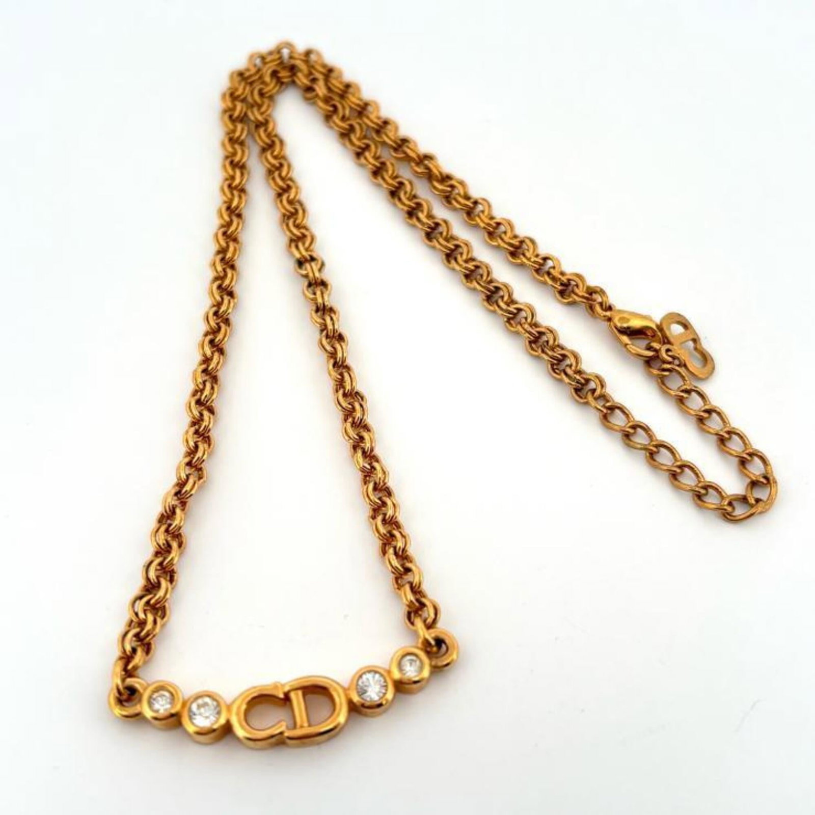Christian Dior Necklace With Logo Cd Rhinestones And Gold Plating.: Christian Dior Necklace With Logo Cd Rhinestones And Gold Plating. Christian Dior Necklace With Logo Cd Rhinestones And Gold Plating features a striking gold plating and rhinestone design, showcasing 